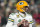 GREEN BAY, WISCONSIN - NOVEMBER 17: Aaron Rodgers #12 of the Green Bay Packers looks to throw a pass against the Tennessee Titans during the second half in the game at Lambeau Field on November 17, 2022 in Green Bay, Wisconsin. (Photo by Patrick McDermott/Getty Images)