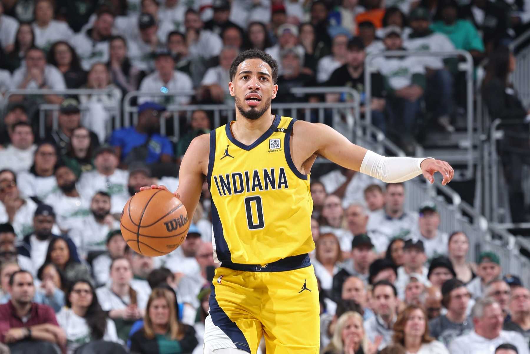 MILWAUKEE, WI - APRIL 23: Tyrese Haliburton #0 of the Indiana Pacers brings the ball up court during Round 1 Game 2 of the 2024 NBA Playoffs against the Milwaukee Bucks on April 23, 2024 at the Fiserv Forum Center in Milwaukee, Wisconsin. NOTE TO USER: User expressly acknowledges and agrees that, by downloading and or using this Photograph, user is consenting to the terms and conditions of the Getty Images License Agreement. Mandatory Copyright Notice: Copyright 2024 NBAE (Photo by Jeff Haynes/NBAE via Getty Images).