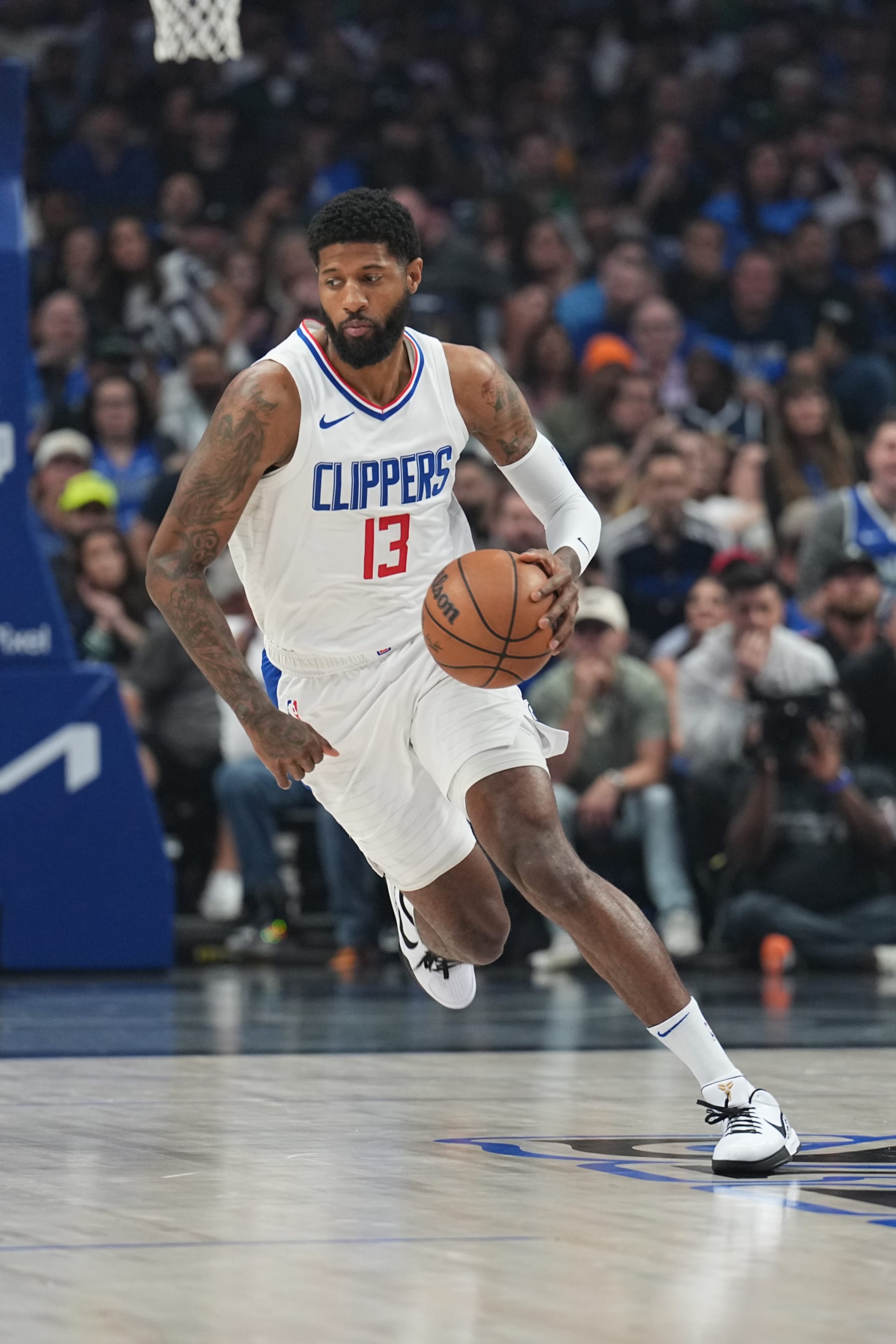 DALLAS, TX - MAY 3:  Paul George #13 of the LA Clippers handles the ball during the game  against the Dallas Mavericks during Round 1 Game 6 of the 2024 NBA Playoffs  on May 3, 2024  at the American Airlines Center in Dallas, Texas. NOTE TO USER: User expressly acknowledges and agrees that, by downloading and or using this photograph, User is consenting to the terms and conditions of the Getty Images License Agreement. Mandatory Copyright Notice: Copyright 2024 NBAE (Photo by Glenn James/NBAE via Getty Images)