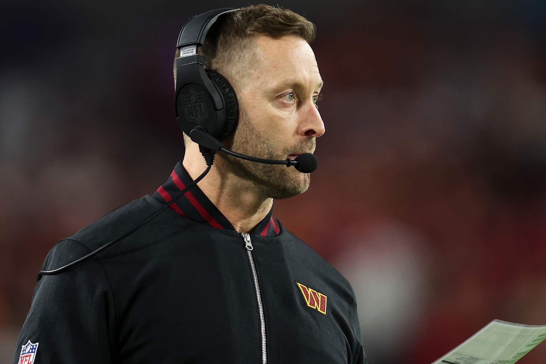 TAMPA, FLORIDA - JANUARY 12:  Washington Commanders offensive coordinator Kliff Kingsbury looks on from the sideline during an NFL football wild card playoff game against the Tampa Bay Buccaneers at Raymond James Stadium on January 12, 2025 in Tampa, Florida. (Photo by Perry Knotts/Getty Images)