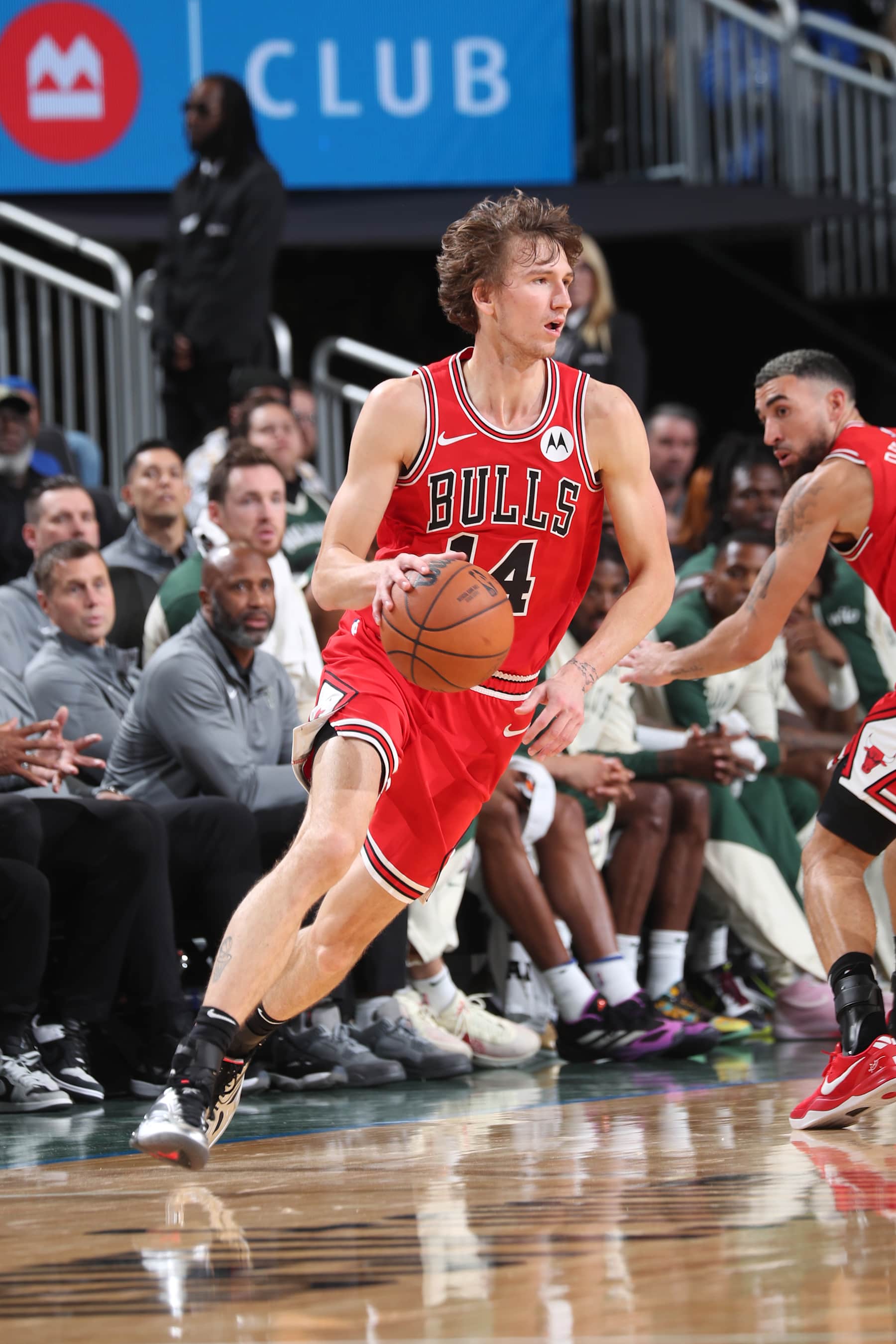 MILWAUKEE, WI - OCTOBER 14: Matas Buzelis #14 of Chicago Bulls dribbles the ball during the game against the Milwaukee Bucks on October 14, 2024 at Fiserv Forum Center in Milwaukee, Wisconsin. NOTE TO USER: User expressly acknowledges and agrees that, by downloading and or using this Photograph, user is consenting to the terms and conditions of the Getty Images License Agreement. Mandatory Copyright Notice: Copyright 2024 NBAE (Photo by Gary Dineen/NBAE via Getty Images).
