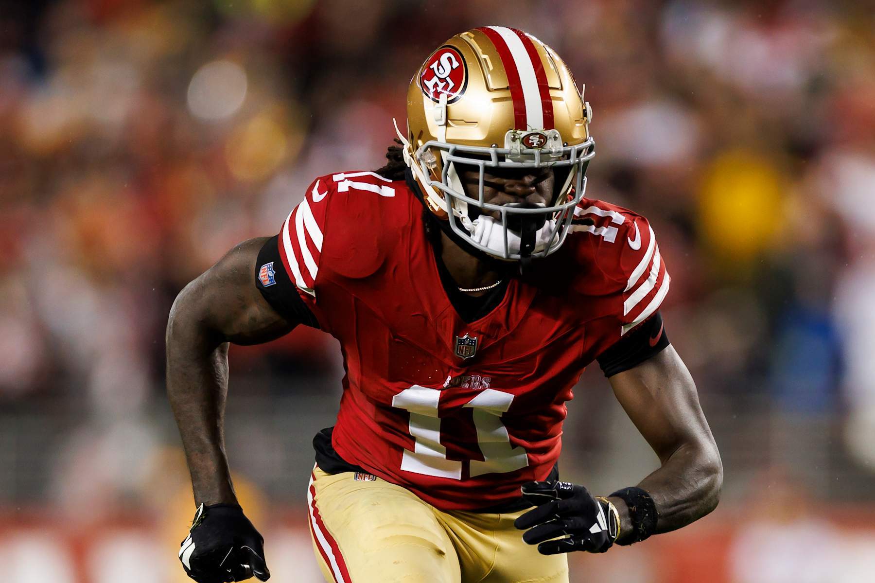 SANTA CLARA, CALIFORNIA - JANUARY 20: Brandon Aiyuk #11 of the San Francisco 49ers runs a route during an NFC divisional round playoff football game against the Green Bay Packers at Levi's Stadium on January 20, 2024 in Santa Clara, California. (Photo by Ryan Kang/Getty Images)