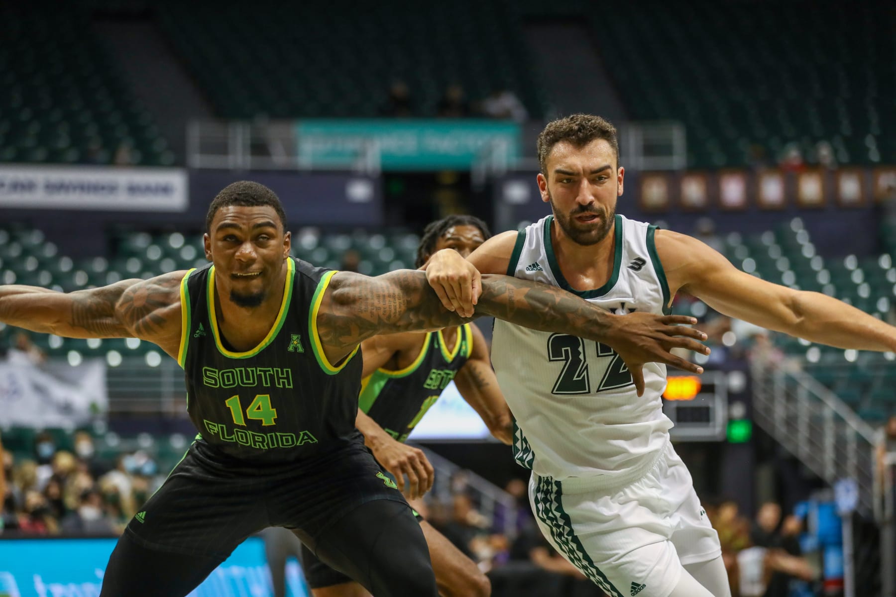 HONOLULU, HI - DECEMBER 23: Bayron Matos #14 of the South Florida Bulls and Jerome Desrosiers #22 of the Hawaii Rainbow Warriors battle for position during the 2021 Diamond Head Classic at the Stan Sheriff Center on December 23, 2021 in Honolulu, Hawaii. (Photo by Darryl Oumi/Getty Images)