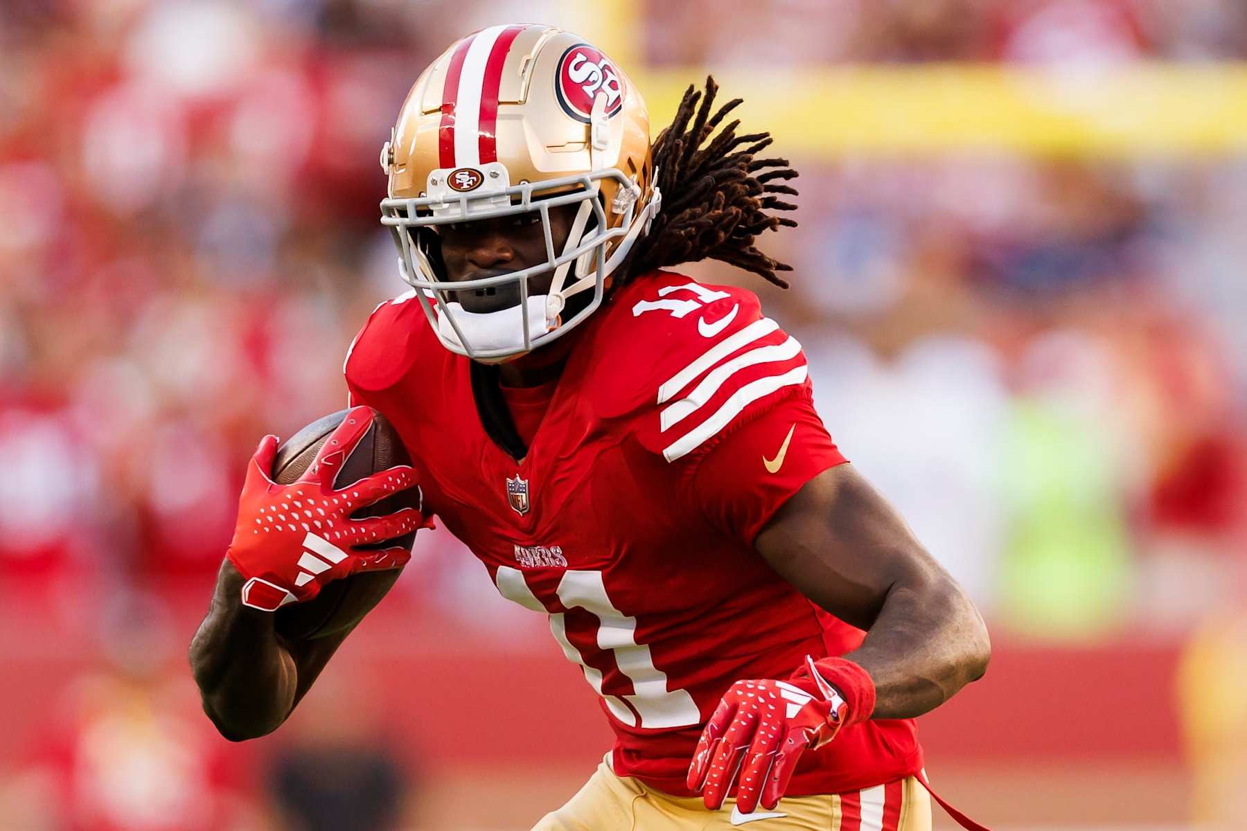SANTA CLARA, CALIFORNIA - OCTOBER 08: Brandon Aiyuk #11 of the San Francisco 49ers runs the ball after a catch during an NFL football game against the Dallas Cowboys at Levi's Stadium on October 8, 2023 in Santa Clara, California. (Photo by Ryan Kang/Getty Images)
