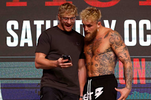 WWE's Logan Paul Reacts to 'F--king Iconic' Mike Tyson-Jake Paul Slap in Viral Video