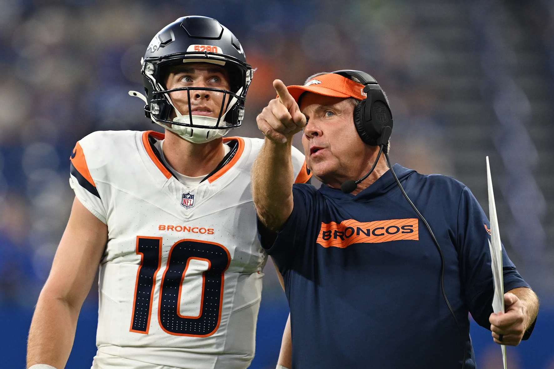 INDIANAPOLIS, INDIANA - AUGUST 11: Denver Broncos quarterback Bo Nix (10), left, talks with Denver Broncos head coach Sean Payton during a drive late in the 2nd quarter at Lucas Oil Stadium in Indianapolis, Indiana on August 11, 2024. The Indianapolis Colts hosted the Denver Broncos for their first NFL Preseason game of the 2024 summer. (Photo by RJ Sangosti/The Denver Post)