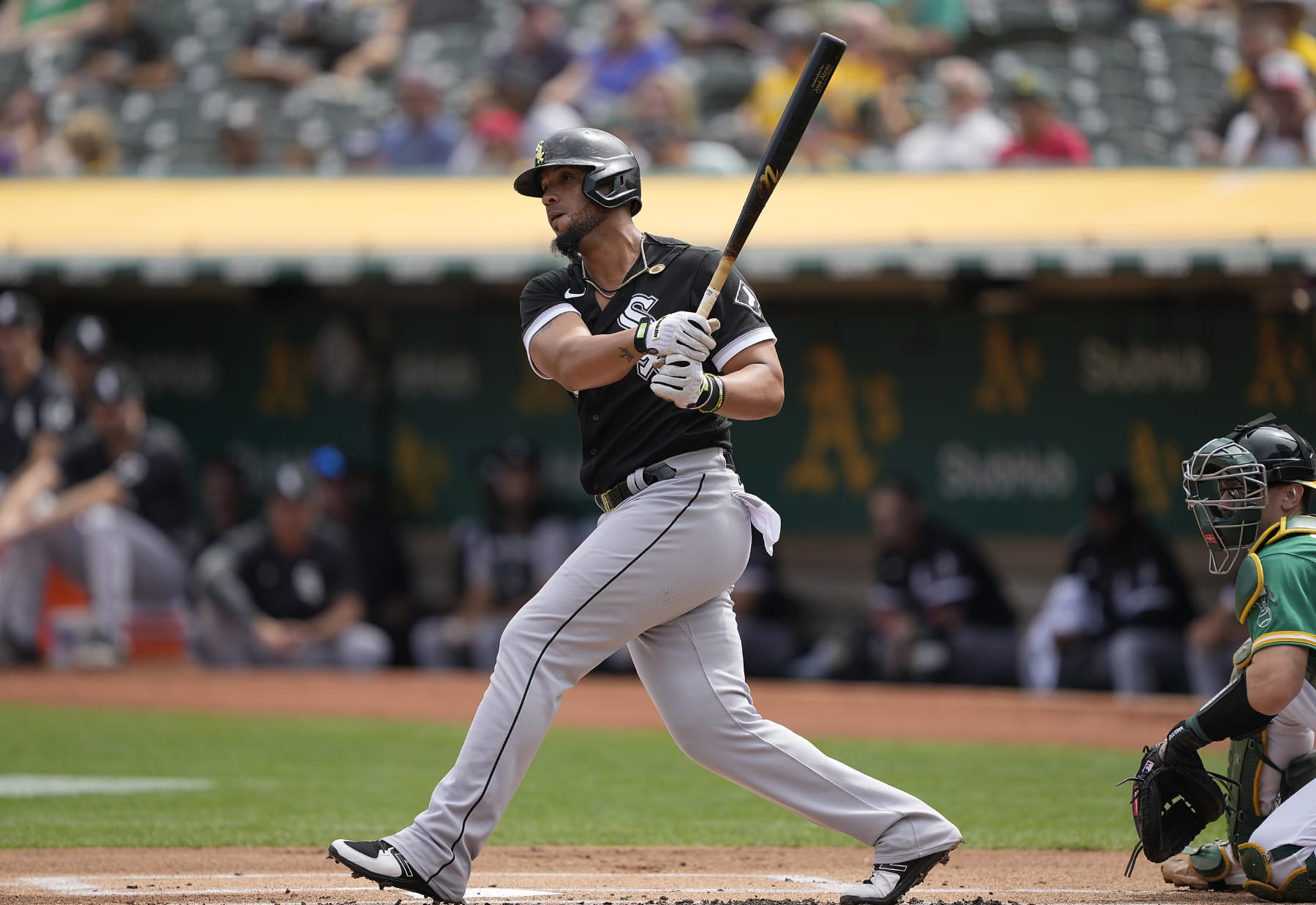 OAKLAND, CALIFORNIA - SEPTEMBER 11: Jose Abreu #79 of the Chicago White Sox hits an rbi double scoring Andrew Vaughn #25 against the Oakland Athletics in the top of the first inning at RingCentral Coliseum on September 11, 2022 in Oakland, California. (Photo by Thearon W. Henderson/Getty Images)