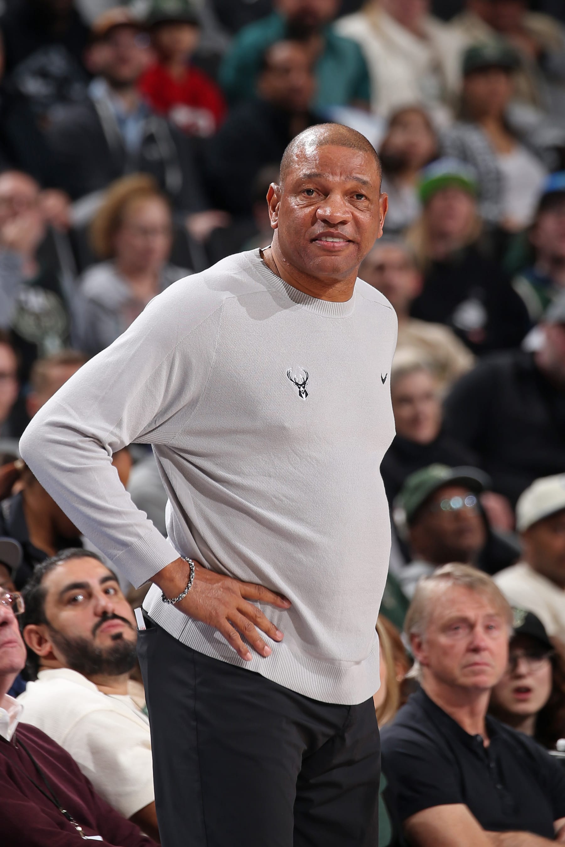 MILWAUKEE, WI - FEBRUARY 12: Head Coach Doc Rivers of the Milwaukee Bucks smiles during the game against the Denver Nuggets on February 12, 2024 at the Fiserv Forum Center in Milwaukee, Wisconsin. NOTE TO USER: User expressly acknowledges and agrees that, by downloading and or using this Photograph, user is consenting to the terms and conditions of the Getty Images License Agreement. Mandatory Copyright Notice: Copyright 2024 NBAE (Photo by Gary Dineen/NBAE via Getty Images).