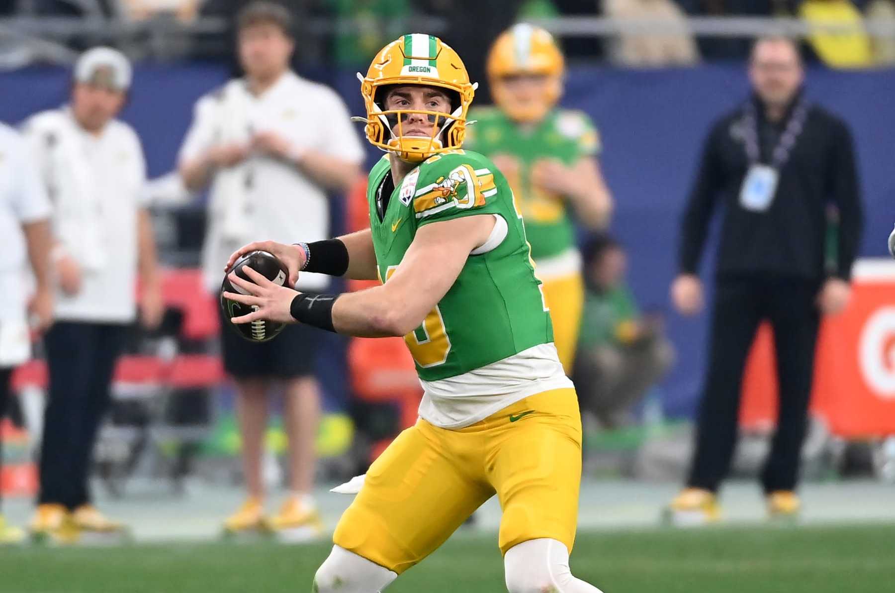GLENDALE, ARIZONA - JANUARY 01: Bo Nix #10 of the Oregon Ducks throws the ball against the Liberty Flames during the 2023 Vrbo Fiesta Bowl game at State Farm Stadium on January 01, 2024 in Glendale, Arizona. (Photo by Norm Hall/Getty Images)