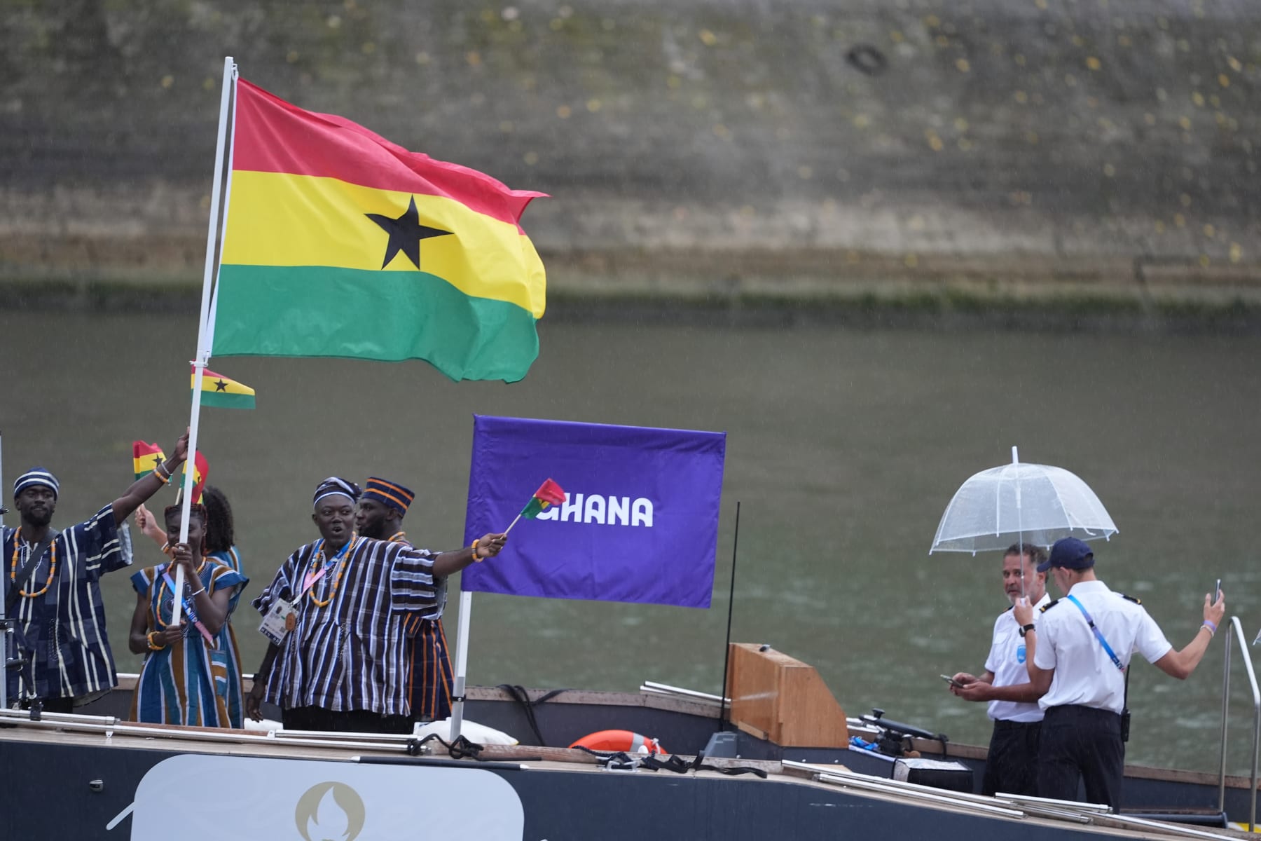 PARIS, FRANCE - JULY 26: Athletes from Ghana's delegation sail in a boat along the river Seine at the start of the opening ceremony of the Paris 2024 Olympic Games in Paris, France on July 26, 2024. (Photo by Aytac Unal/Anadolu via Getty Images)