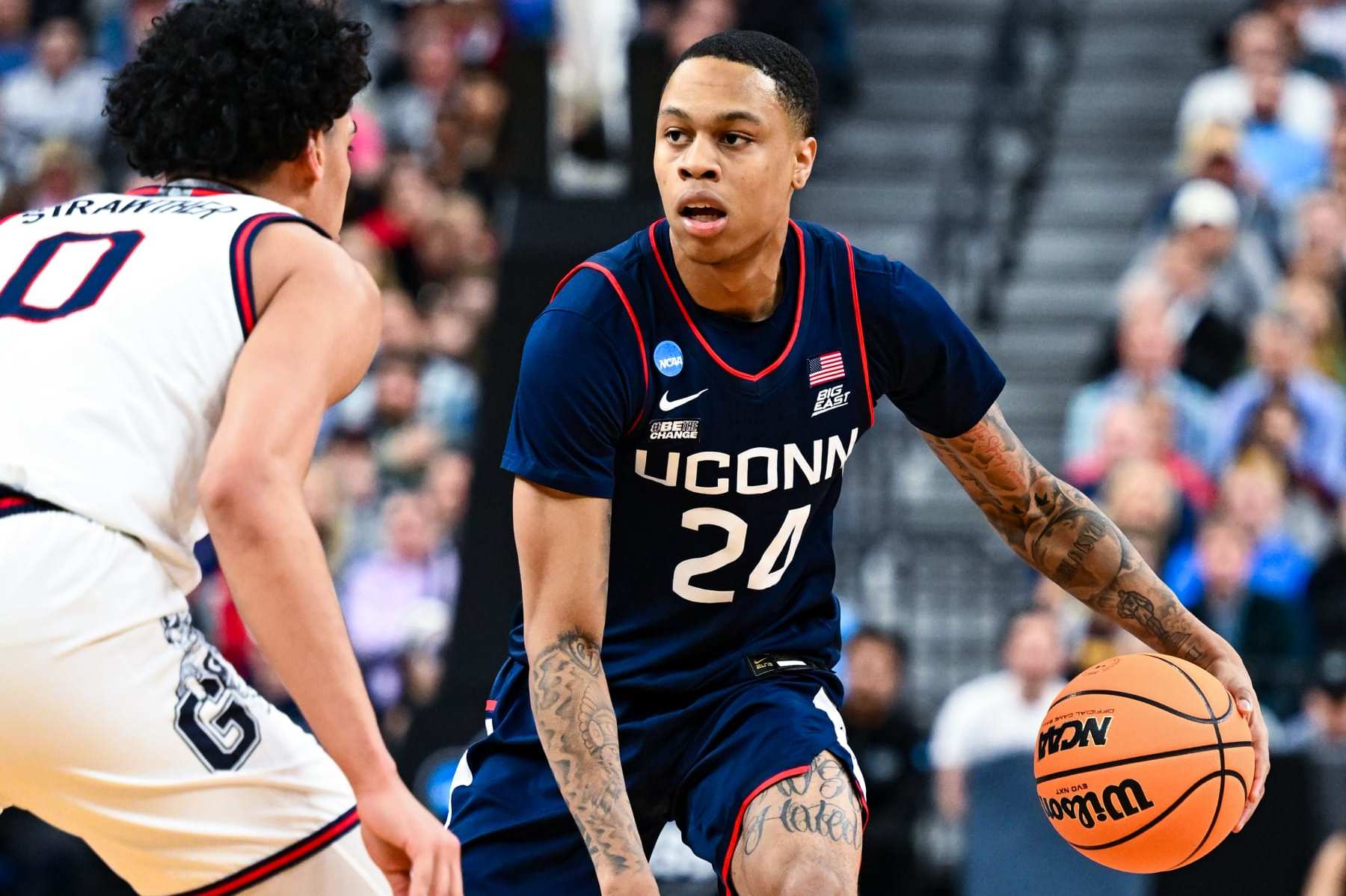 LAS VEGAS, NV - MARCH 25: Jordan Hawkins #24 of the Connecticut Huskies handles the ball against Julian Strawther #0 of the Gonzaga Bulldogs during the Elite Eight round of the 2023 NCAA Men's Basketball Tournament held at T-Mobile Arena on March 25, 2023 in Las Vegas, Nevada. (Photo by Brett Wilhelm/NCAA Photos via Getty Images) LAS VEGAS, NV - MARCH 25: Jordan Hawkins #24 of the Connecticut Huskies handles the ball against Julian Strawther #0 of the Gonzaga Bulldogs during the Elite Eight round of the 2023 NCAA Men's Basketball Tournament held at T-Mobile Arena on March 25, 2023 in Las Vegas, Nevada. (Photo by Brett Wilhelm/NCAA Photos via Getty Images)