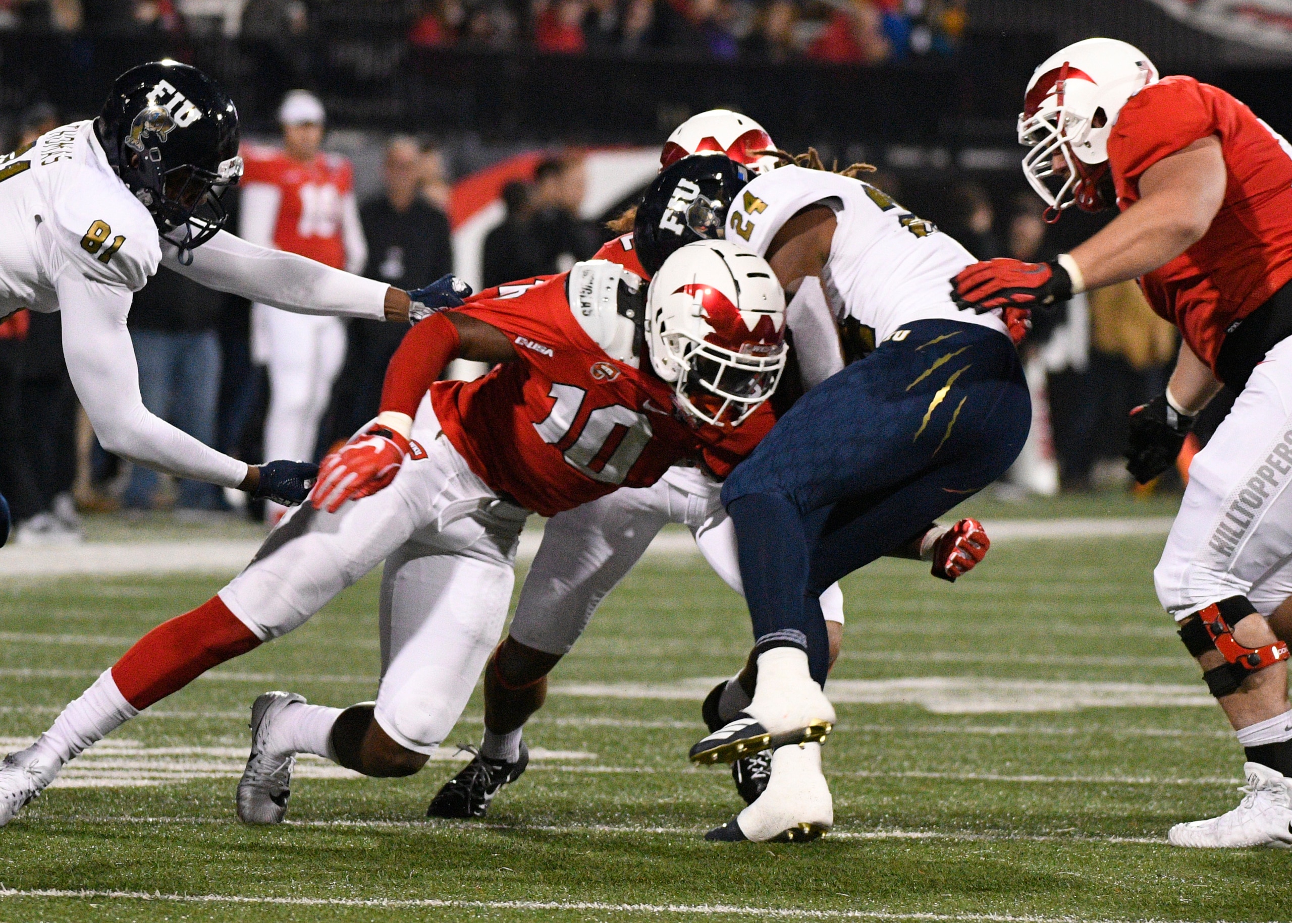 BOWLING GREEN, KY - OCTOBER 27: Western Kentucky Hilltoppers defensive lineman DeAngelo Malone (10) tackles FIU Panthers running back D'Vonte Price (24) for a loss during a college football game between the FIU Panthers and the Western Kentucky Hilltoppers on October 27, 2018, at Houchens Industries-L.T. Smith Stadium in Bowling Green, KY. (Photo by Steve  Roberts/Icon Sportswire via Getty Images)