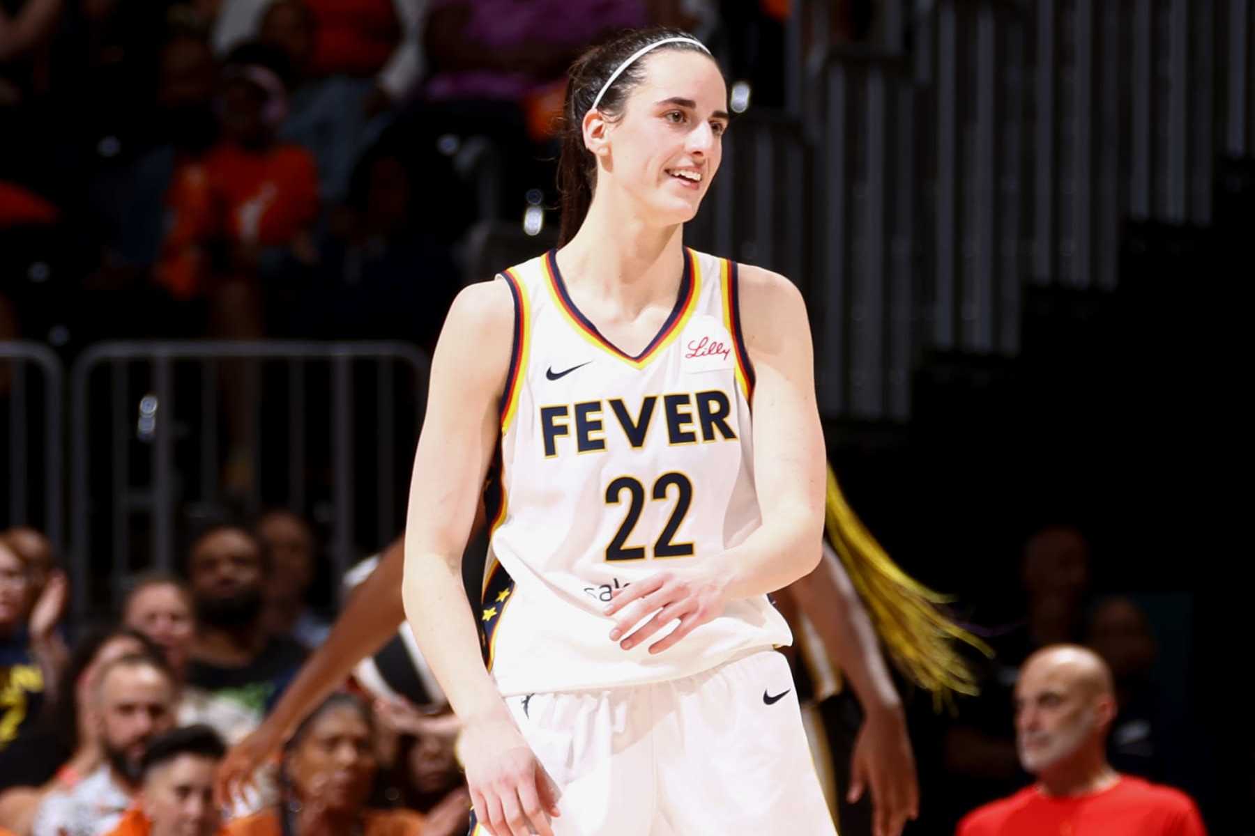 WASHINGTON, DC - JUNE 7: Caitlin Clark #22 of the Indiana Fever smiles during the game against the Washington Mystics during a 2024 Commissioner's Cup game on June 7, 2024 at Capital One Arena in Washington, DC. NOTE TO USER: User expressly acknowledges and agrees that, by downloading and or using this Photograph, user is consenting to the terms and conditions of the Getty Images License Agreement. Mandatory Copyright Notice: Copyright 2024 NBAE (Photo by Kenny Giarla/NBAE via Getty Images)