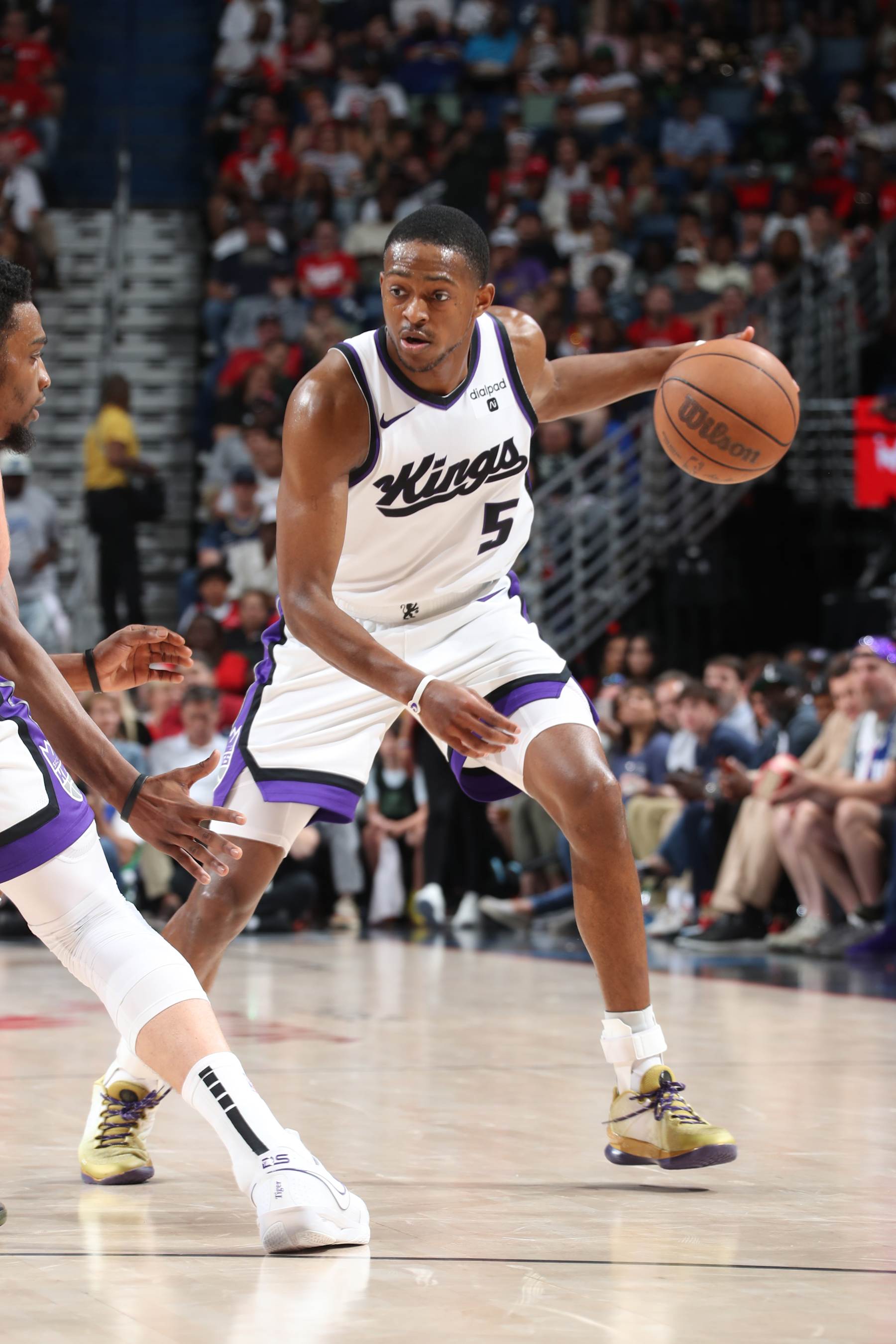NEW ORLEANS, LA - APRIL 19: De'Aaron Fox #5 of the Sacramento Kings dribbles the ball during the game against the New Orleans Pelicans during the 2024 NBA Play-In Tournament on April 19, 2024 at the Smoothie King Center in New Orleans, Louisiana. NOTE TO USER: User expressly acknowledges and agrees that, by downloading and or using this Photograph, user is consenting to the terms and conditions of the Getty Images License Agreement. Mandatory Copyright Notice: Copyright 2024 NBAE (Photo by Layne Murdoch Jr./NBAE via Getty Images)