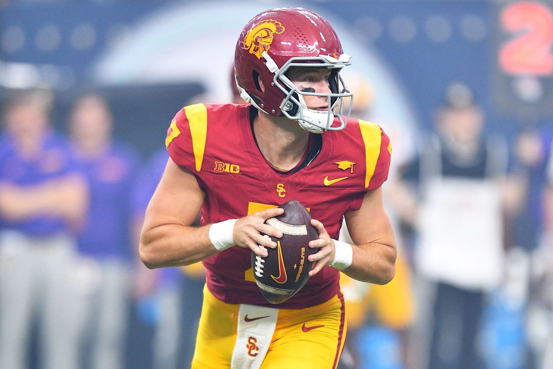 LAS VEGAS, NV - SEPTEMBER 01: USC Trojans quarterback Miller Moss (7) rolls out during the Modelo Vegas Kickoff Classic game between the LSU Tigers and the USC Trojans on September 1, 2024 at Allegiant Stadium in Las Vegas, Nevada. (Photo by Brian Rothmuller/Icon Sportswire via Getty Images)
