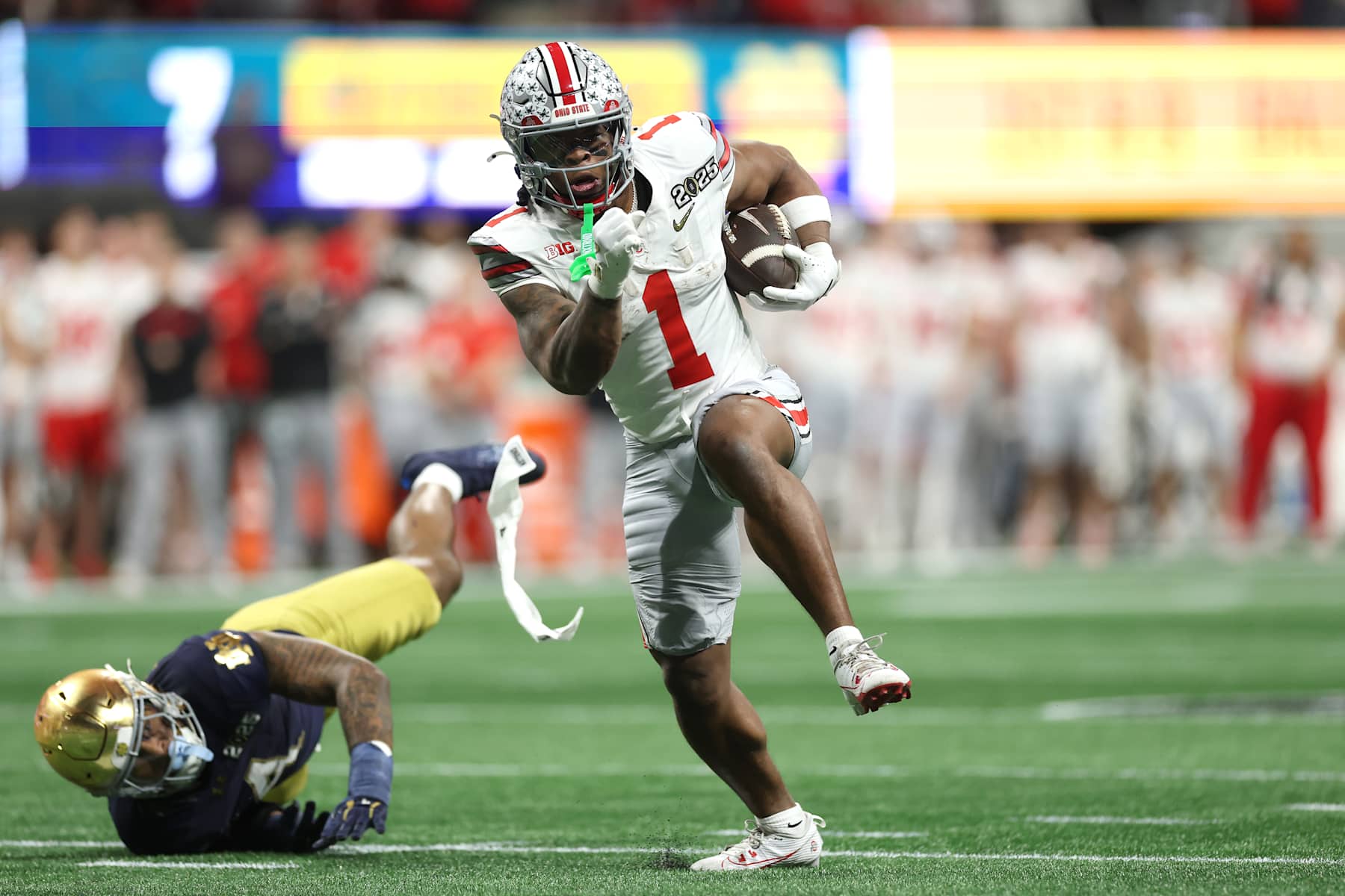 ATLANTA, GEORGIA - JANUARY 20: Quinshon Judkins #1 of the Ohio State Buckeyes runs for a touchdown against the Notre Dame Fighting Irish during the second quarter in the 2025 CFP National Championship at the Mercedes-Benz Stadium on January 20, 2025 in Atlanta, Georgia. (Photo by Jamie Squire/Getty Images)