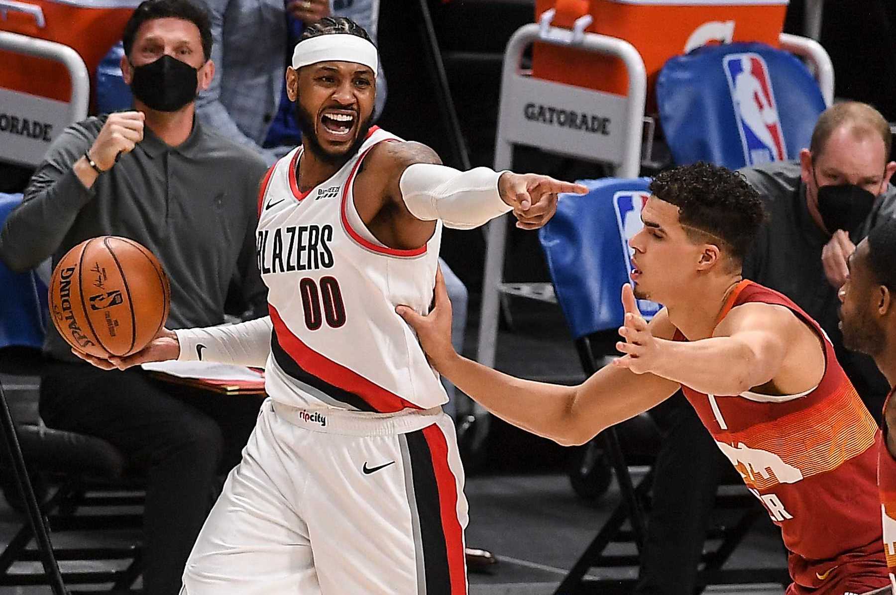 DENVER, CO - FEBRUARY 23: Carmelo Anthony (00) of the Portland Trail Blazers handles the ball as Michael Porter Jr. (1) of the Denver Nuggets defends during the second quarter at Ball Arena on Tuesday, February 23, 2021. (Photo by AAron Ontiveroz/The Denver Post)