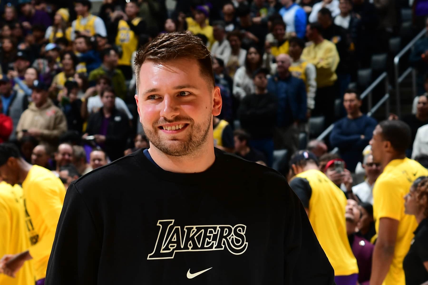 LOS ANGELES, CA - FEBRUARY 6: Luka Doncic #77 of the Los Angeles Lakers smiles before the game against the Golden State Warriors on February 6, 2025 at Crypto.Com Arena in Los Angeles, California. NOTE TO USER: User expressly acknowledges and agrees that, by downloading and/or using this Photograph, user is consenting to the terms and conditions of the Getty Images License Agreement. Mandatory Copyright Notice: Copyright 2025 NBAE (Photo by Adam Pantozzi/NBAE via Getty Images)
