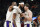 From left, Los Angeles Lakers LeBron James, Anthony Davis, and Austin Reaves celebrate their 124-117 win over the Detroit Pistons in an NBA basketball game, Sunday, Dec. 11, 2022, in Detroit. (AP Photo/Jose Juarez)