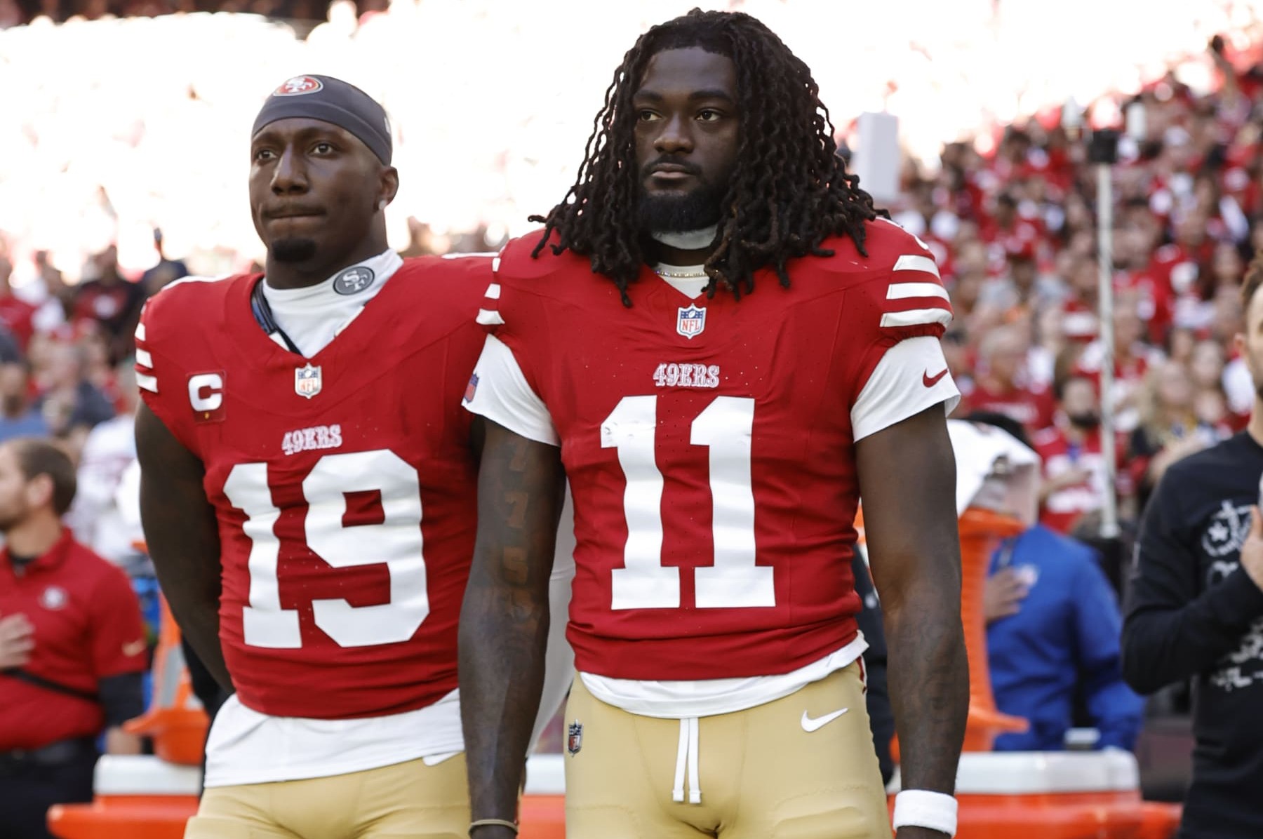 GLENDALE, AZ - DECEMBER 17: Deebo Samuel #19 and Brandon Aiyuk #11 of the San Francisco 49ers on the sideline before the game against the Arizona Cardinals at State Farm Stadium on December 17, 2023 in Glendale, Arizona. The 49ers defeated the Cardinals 45-29. (Photo by Michael Zagaris/San Francisco 49ers/Getty Images)