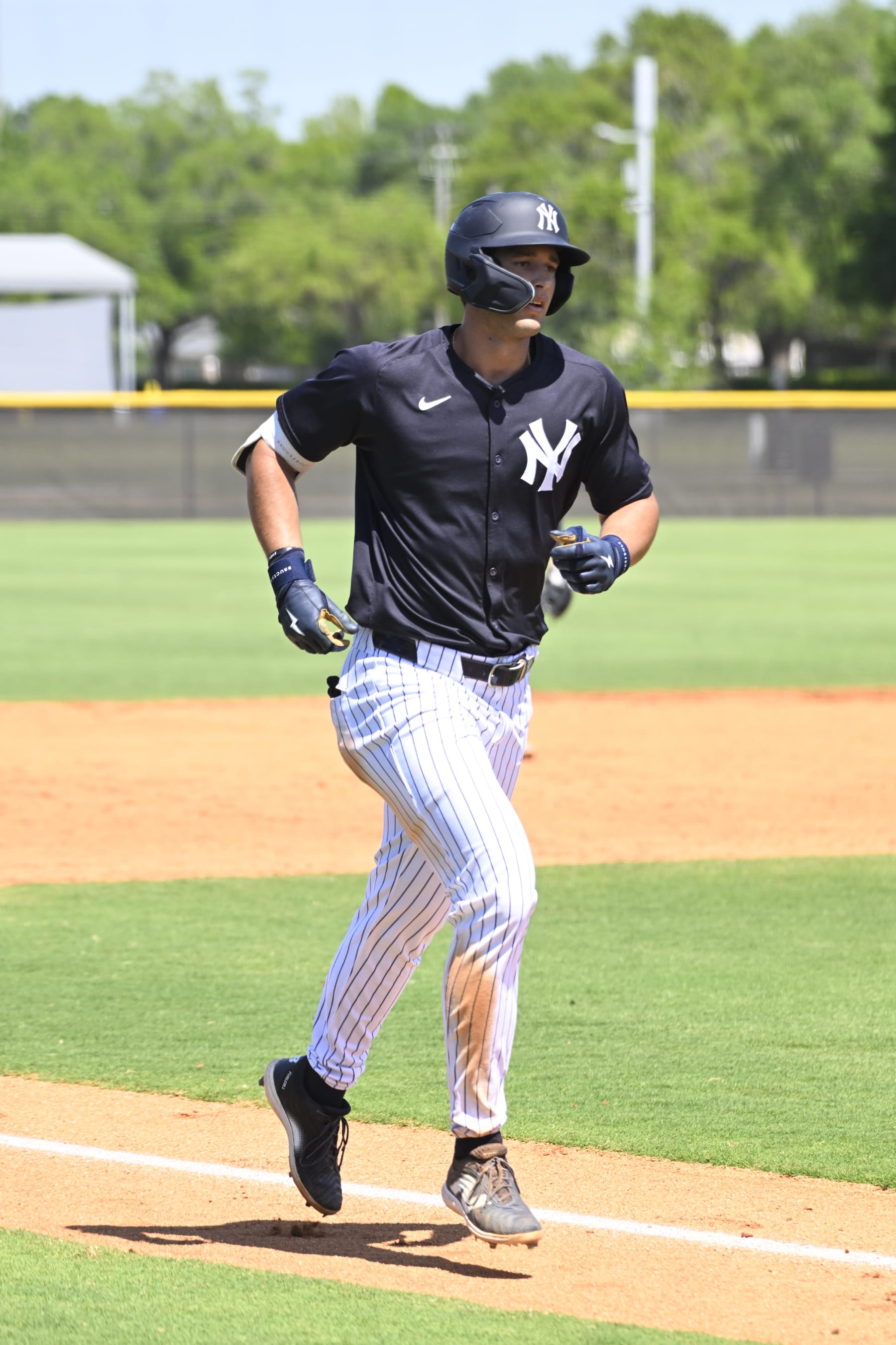 TAMPA, FLORIDA - MARCH 21, 2024: Spencer Jones #70 of the New York Yankees runs the bases after hitting solo a home run during a minor league spring training game against the Detroit Tigers at the Himes Complex on March 21, 2024 in Tampa, Florida. (Photo by Diamond Images via Getty Images)