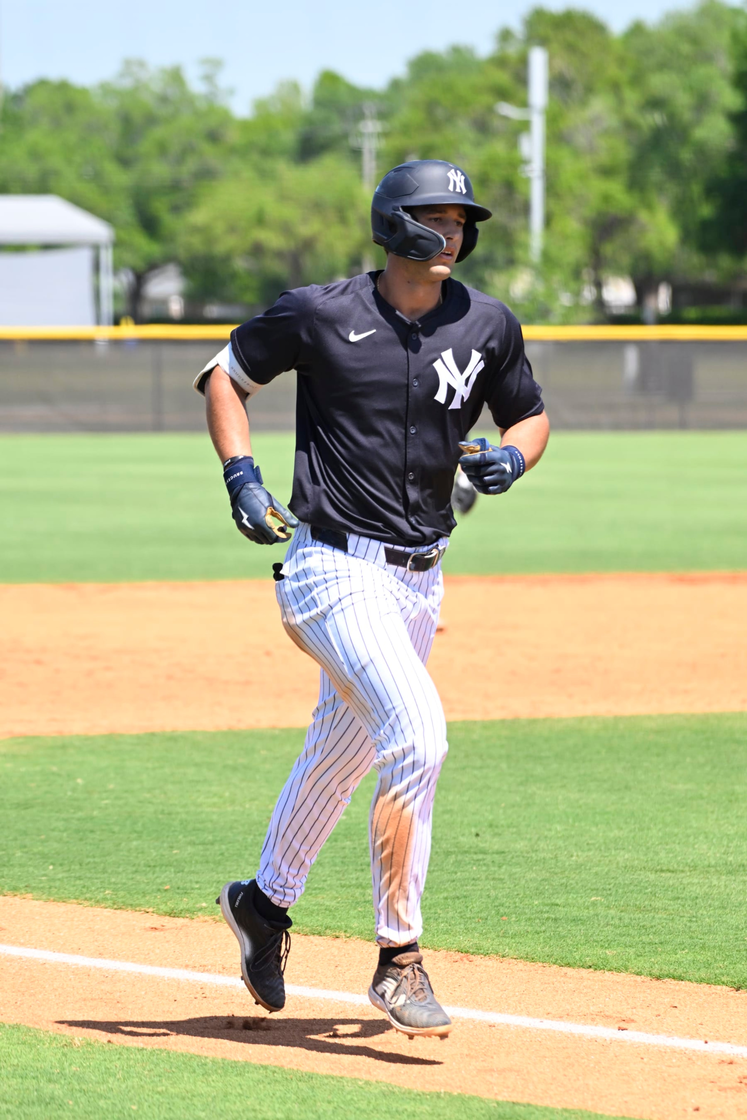 TAMPA, FLORIDA - MARCH 21, 2024: Spencer Jones #70 of the New York Yankees runs the bases after hitting solo a home run during a minor league spring training game against the Detroit Tigers at the Himes Complex on March 21, 2024 in Tampa, Florida. (Photo by Diamond Images via Getty Images)