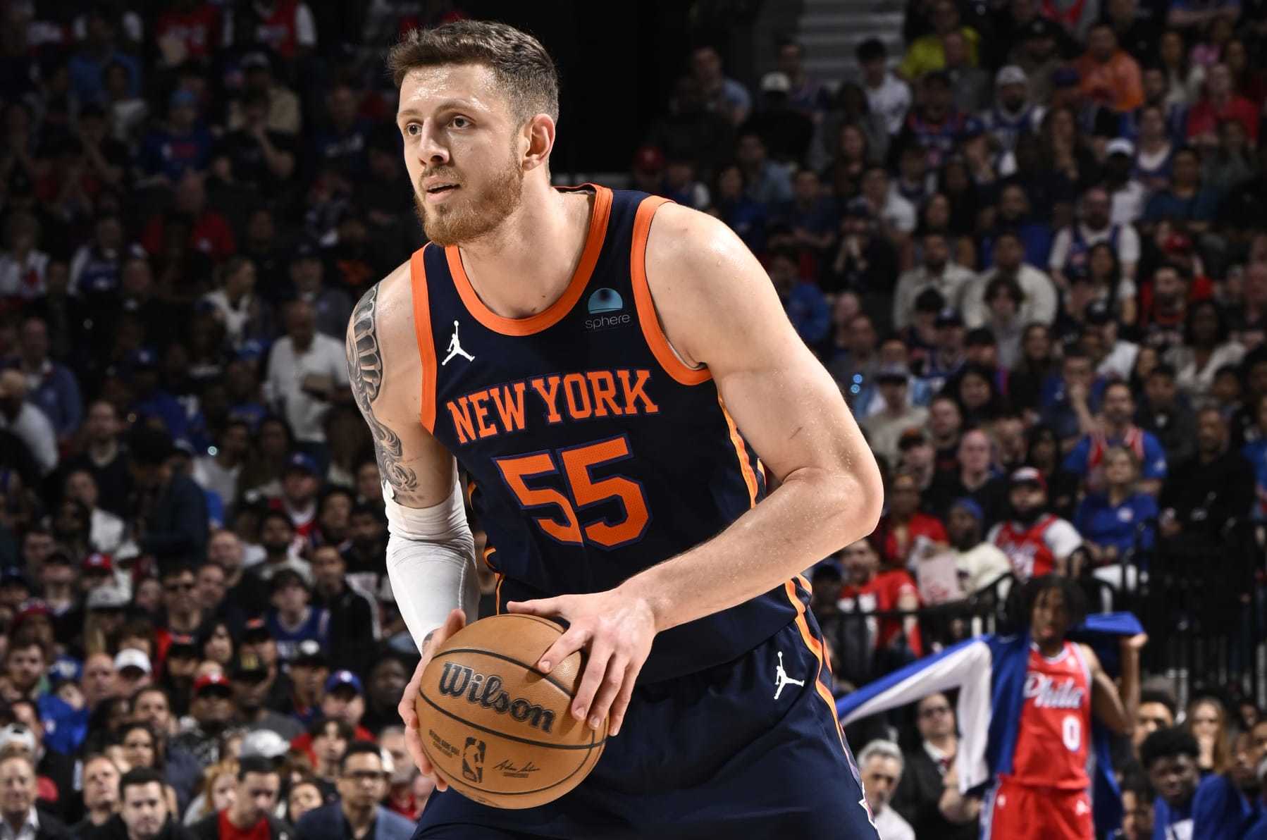 PHILADELPHIA, PA - APRIL 28: Isaiah Hartenstein #55 of the New York Knicks looks to pass the ball during the game against the Philadelphia 76ers during Round 1 Game 4 of the 2024 NBA Playoffs on April 28, 2024 at the Wells Fargo Center in Philadelphia, Pennsylvania NOTE TO USER: User expressly acknowledges and agrees that, by downloading and/or using this Photograph, user is consenting to the terms and conditions of the Getty Images License Agreement. Mandatory Copyright Notice: Copyright 2024 NBAE (Photo by David Dow/NBAE via Getty Images)