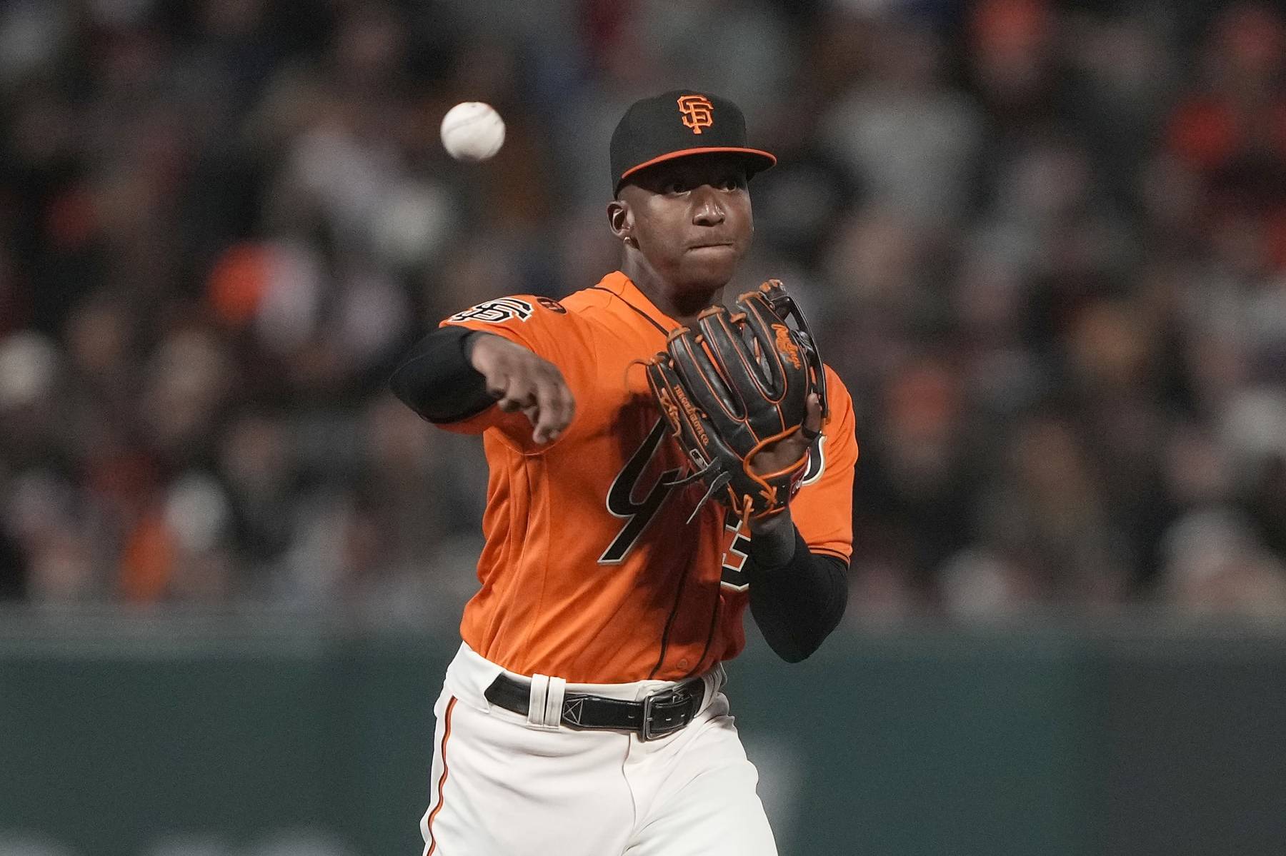 SAN FRANCISCO, CALIFORNIA - SEPTEMBER 29: Marco Luciano #37 of the San Francisco Giants throws to first base throwing out Enrique Hernandez #8 of the Los Angeles Dodgers in the top of the ninth inning at Oracle Park on September 29, 2023 in San Francisco, California. (Photo by Thearon W. Henderson/Getty Images)