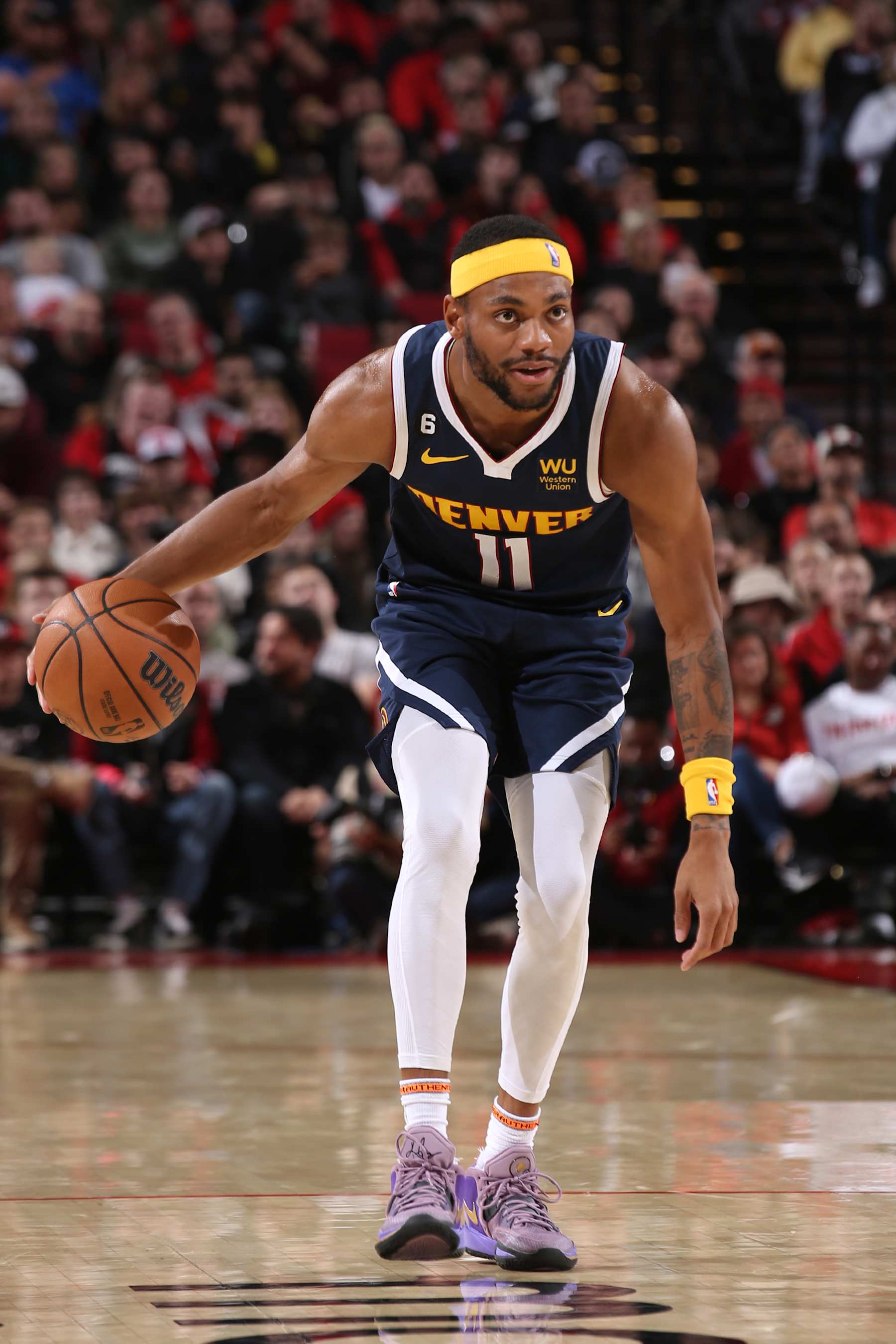 PORTLAND, OR - OCTOBER 24: Bruce Brown #11 of the Denver Nuggets handles the ball during the game against the Portland Trail Blazers on October 24, 2022 at the Moda Center Arena in Portland, Oregon. NOTE TO USER: User expressly acknowledges and agrees that, by downloading and or using this photograph, user is consenting to the terms and conditions of the Getty Images License Agreement. Mandatory Copyright Notice: Copyright 2022 NBAE (Photo by Cameron Browne/NBAE via Getty Images)