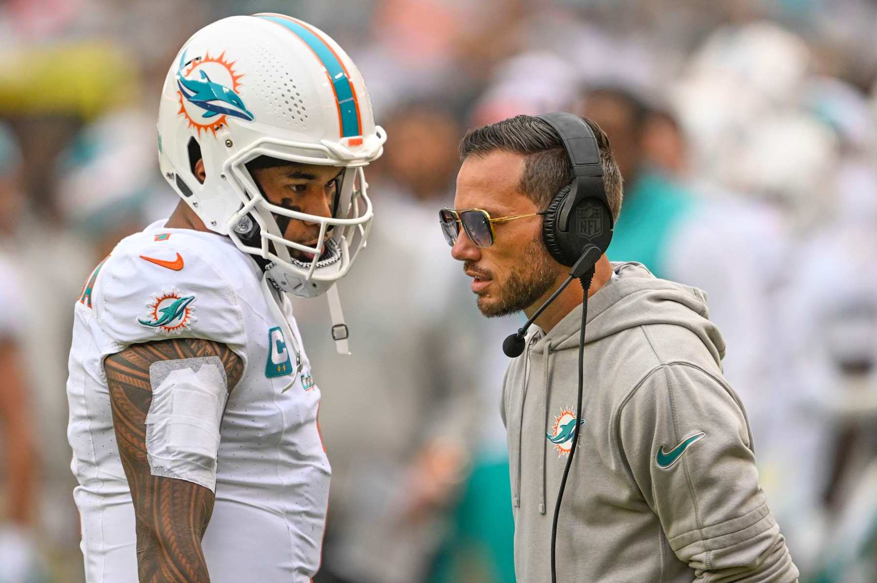 LANDOVER, MD -DECEMBER 3: Miami Dolphins quarterback Tua Tagovailoa (1) talks with head coach Mike McDaniel during third quarter action against the Washington Commanders at FedEx Field on December 3, 2023. (Photo by Jonathan Newton/The Washington Post via Getty Images)