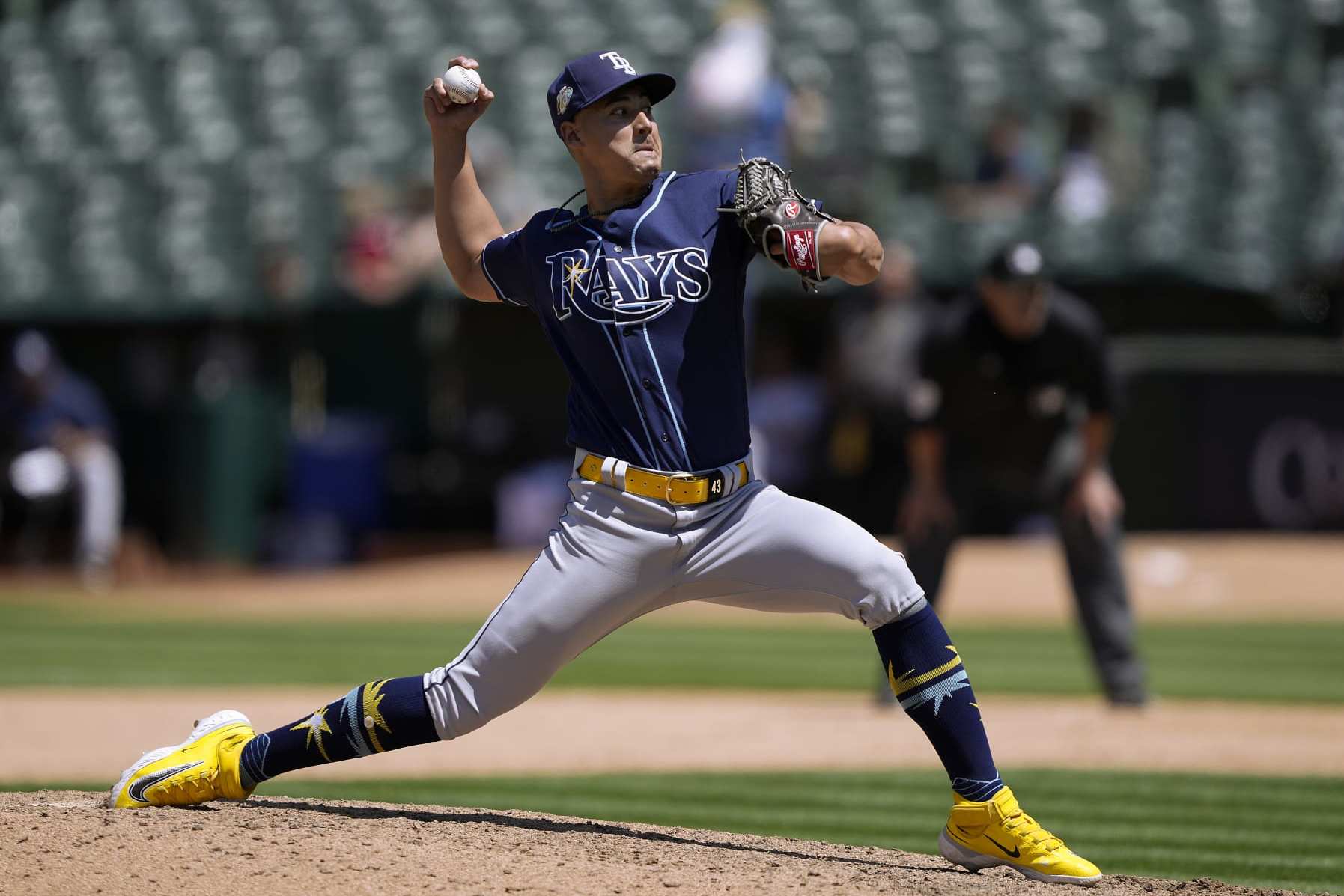 OAKLAND, CALIFORNIA - JUNE 15: Robert Stephenson #26 of the Tampa Bay Rays pitches against the Oakland Athletics in the bottom of the seventh inning of a major league baseball game at RingCentral Coliseum on June 15, 2023 in Oakland, California. (Photo by Thearon W. Henderson/Getty Images)