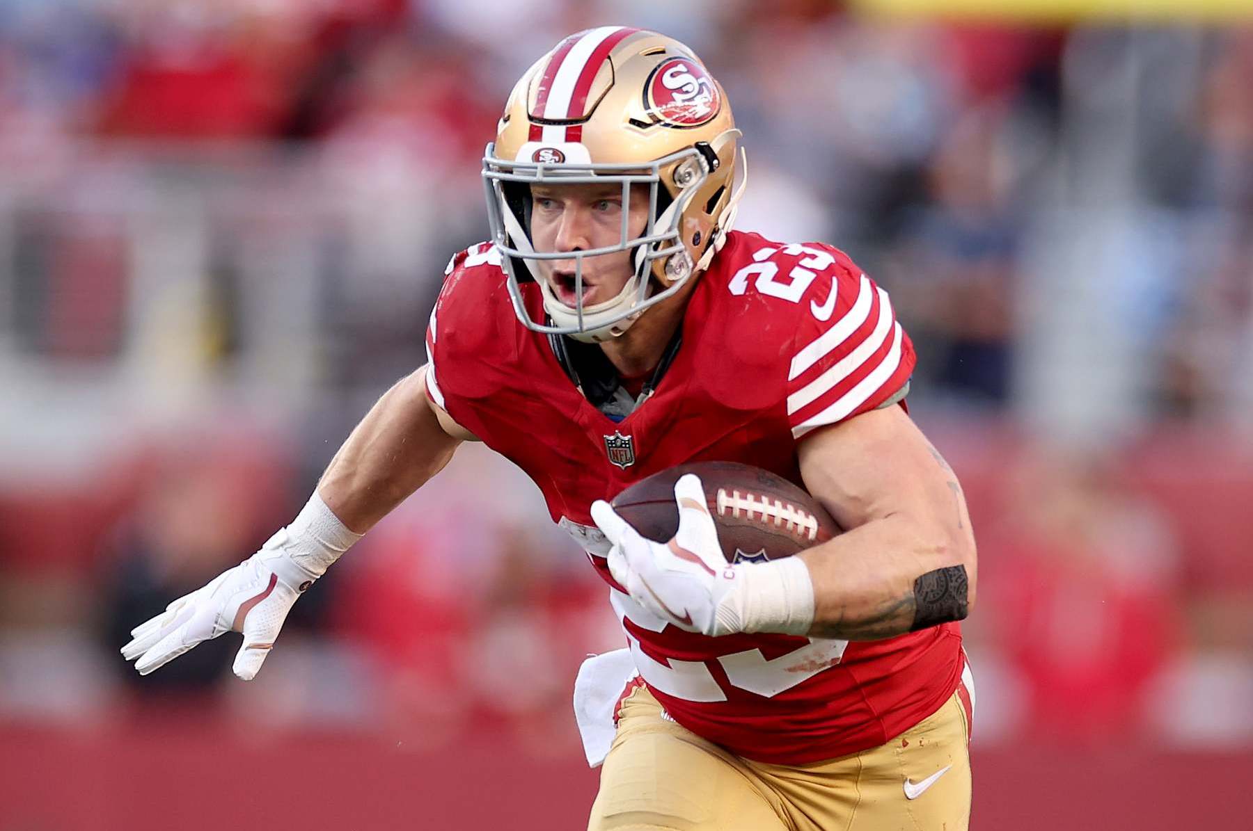 SANTA CLARA, CALIFORNIA - JANUARY 28: Christian McCaffrey #23 of the San Francisco 49ers runs with the ball against the Detroit Lions in the NFC Championship Game at Levi's Stadium on January 28, 2024 in Santa Clara, California. (Photo by Ezra Shaw/Getty Images)