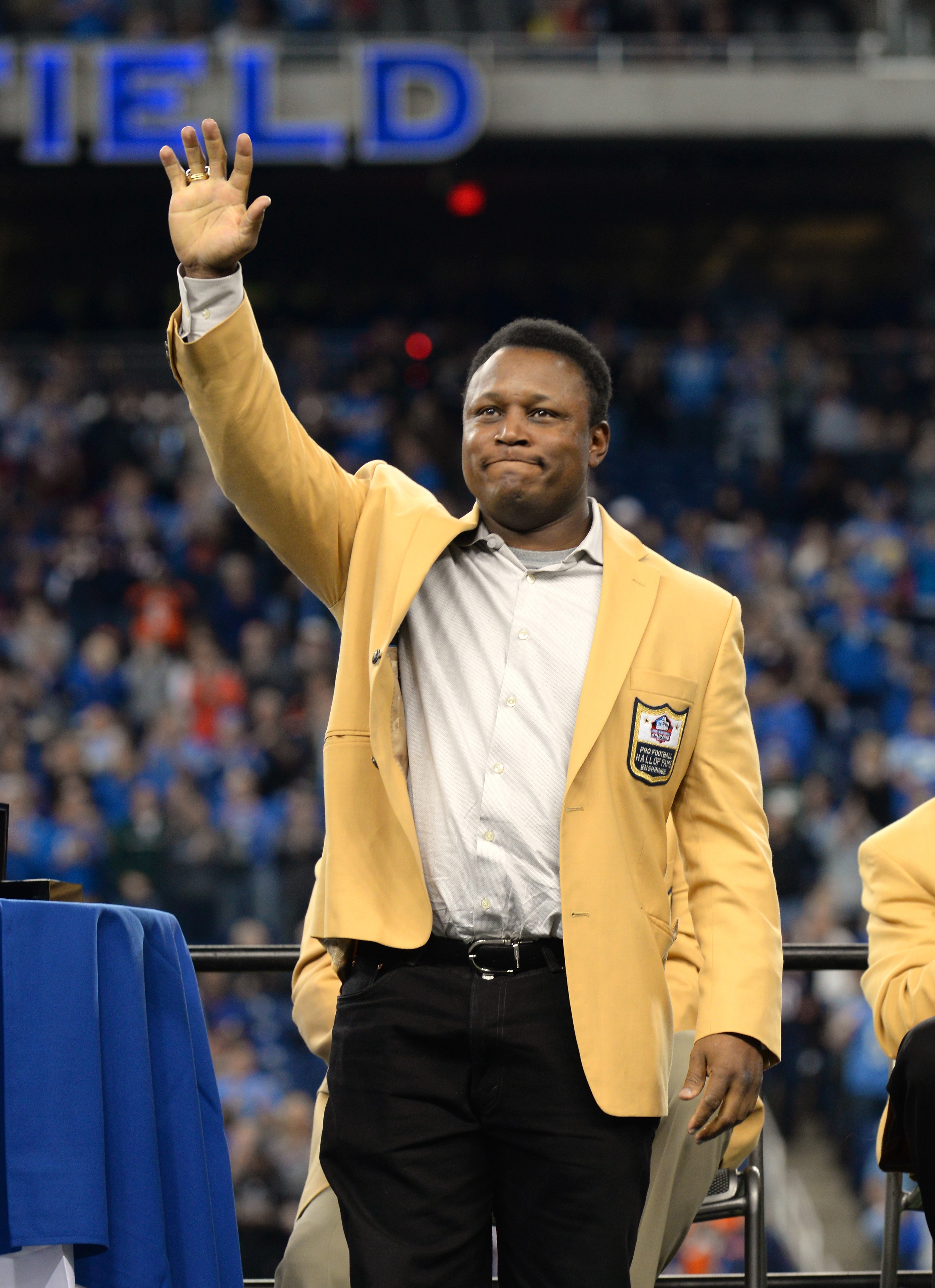 DETROIT, MI - OCTOBER 18:  Former Detroit Lions running back and Pro Football Hall-of-Fame member Barry Sanders waves to the crowd after receiving his Pro Football Hall of Fame Ring of Excellence during a halftime show of the game between the Detroit Lions and the Chicago Bears at Ford Field on October 18, 2015 in Detroit, Michigan. The Lions defeated the Bears in overtime 37-34.  (Photo by Mark Cunningham/Detroit Lions/Getty Images)