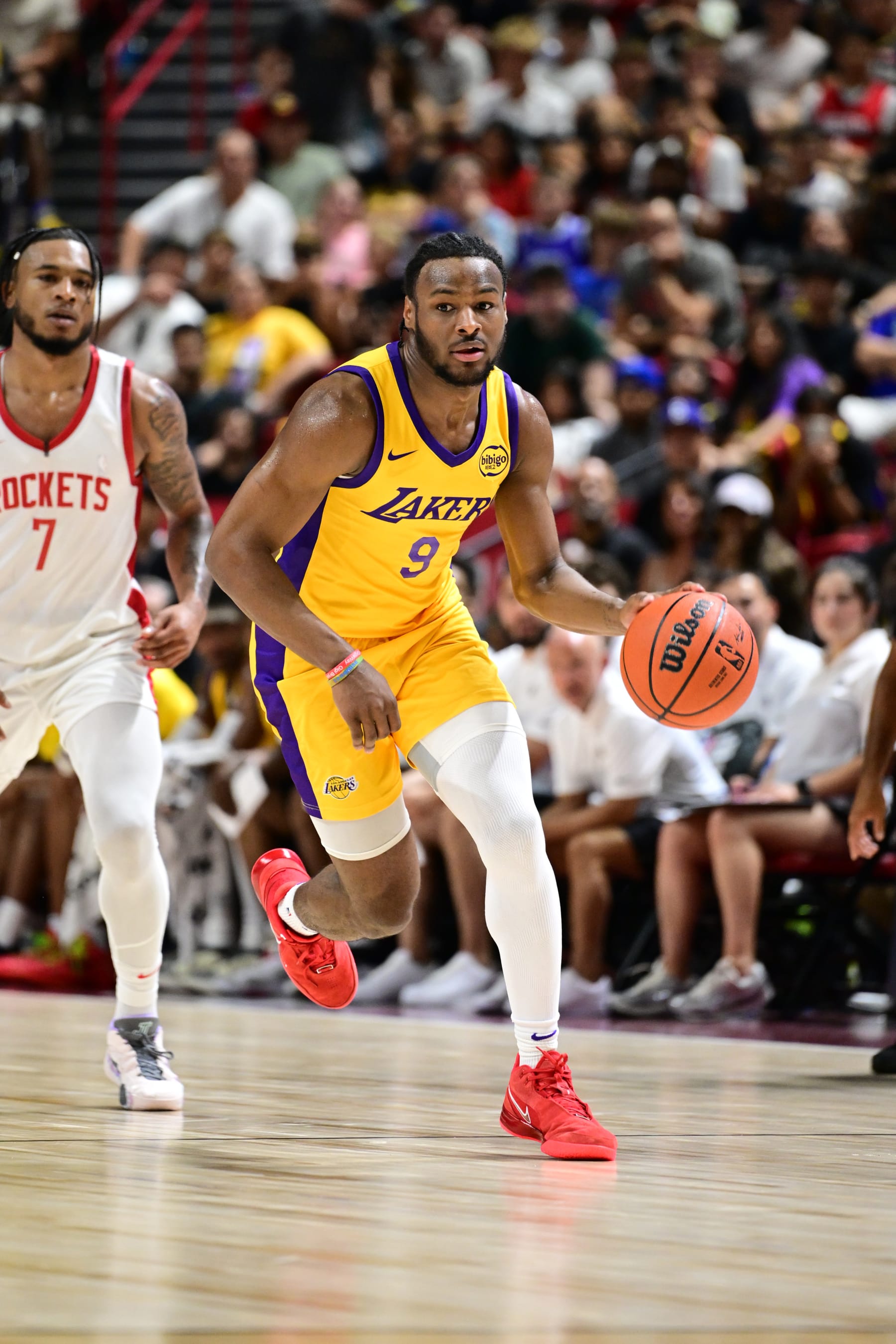 LAS VEGAS, NV - JULY 12: Bronny James Jr. #9 of the Los Angeles Lakers dribbles the ball during the game against the Houston Rockets on July 12, 2024 at the Thomas & Mack Center in Las Vegas, Nevada. NOTE TO USER: User expressly acknowledges and agrees that, by downloading and or using this photograph, User is consenting to the terms and conditions of the Getty Images License Agreement. Mandatory Copyright Notice: Copyright 2024 NBAE (Photo by Adam Hagy/NBAE via Getty Images)