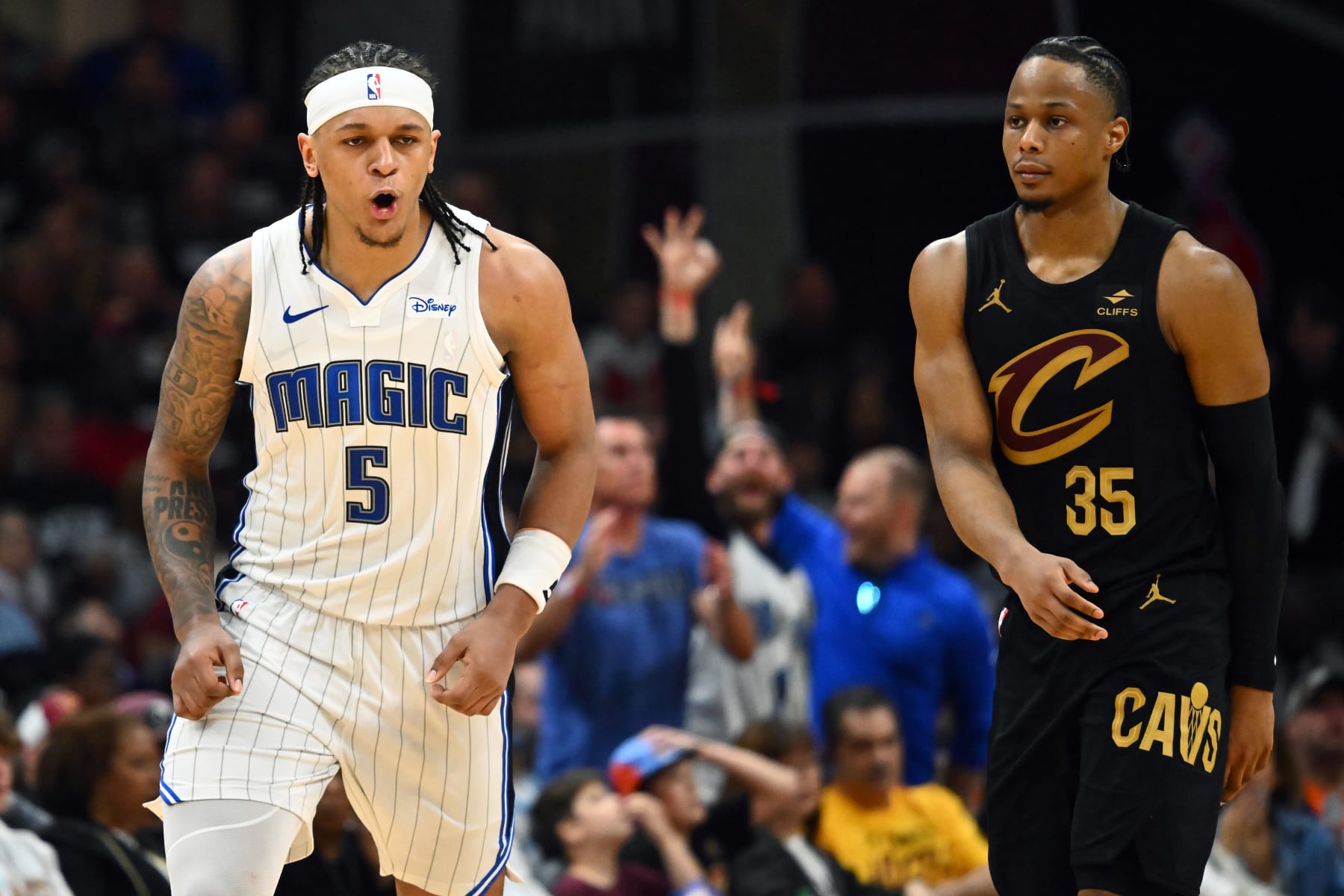 CLEVELAND, OHIO - MAY 05: Paolo Banchero #5 of the Orlando Magic reacts after scoring over Isaac Okoro #35 of the Cleveland Cavaliers during the third quarter of Game Seven of the Eastern Conference First Round Playoffs at Rocket Mortgage Fieldhouse on May 05, 2024 in Cleveland, Ohio. The Cavaliers defeated the Magic 106-94. NOTE TO USER: User expressly acknowledges and agrees that, by downloading and/or using this Photograph, user is consenting to the terms and conditions of the Getty Images License Agreement. (Photo by Jason Miller/Getty Images)