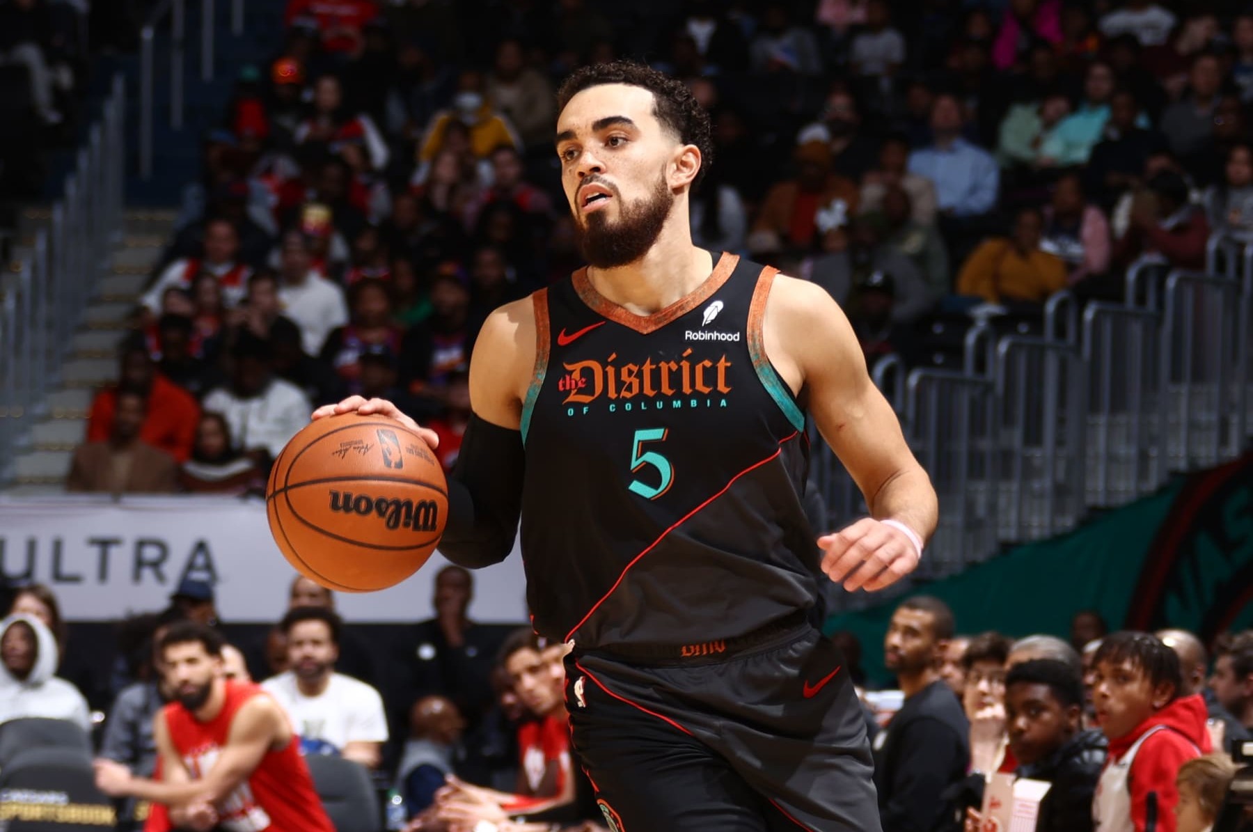 WASHINGTON, DC -  FEBRUARY 4: Tyus Jones #5 of the Washington Wizards dribbles the ball during the game against the Phoenix Suns on February 4, 2024 at Capital One Arena in Washington, DC. NOTE TO USER: User expressly acknowledges and agrees that, by downloading and or using this Photograph, user is consenting to the terms and conditions of the Getty Images License Agreement. Mandatory Copyright Notice: Copyright 2024 NBAE (Photo by Kenny Giarla/NBAE via Getty Images)