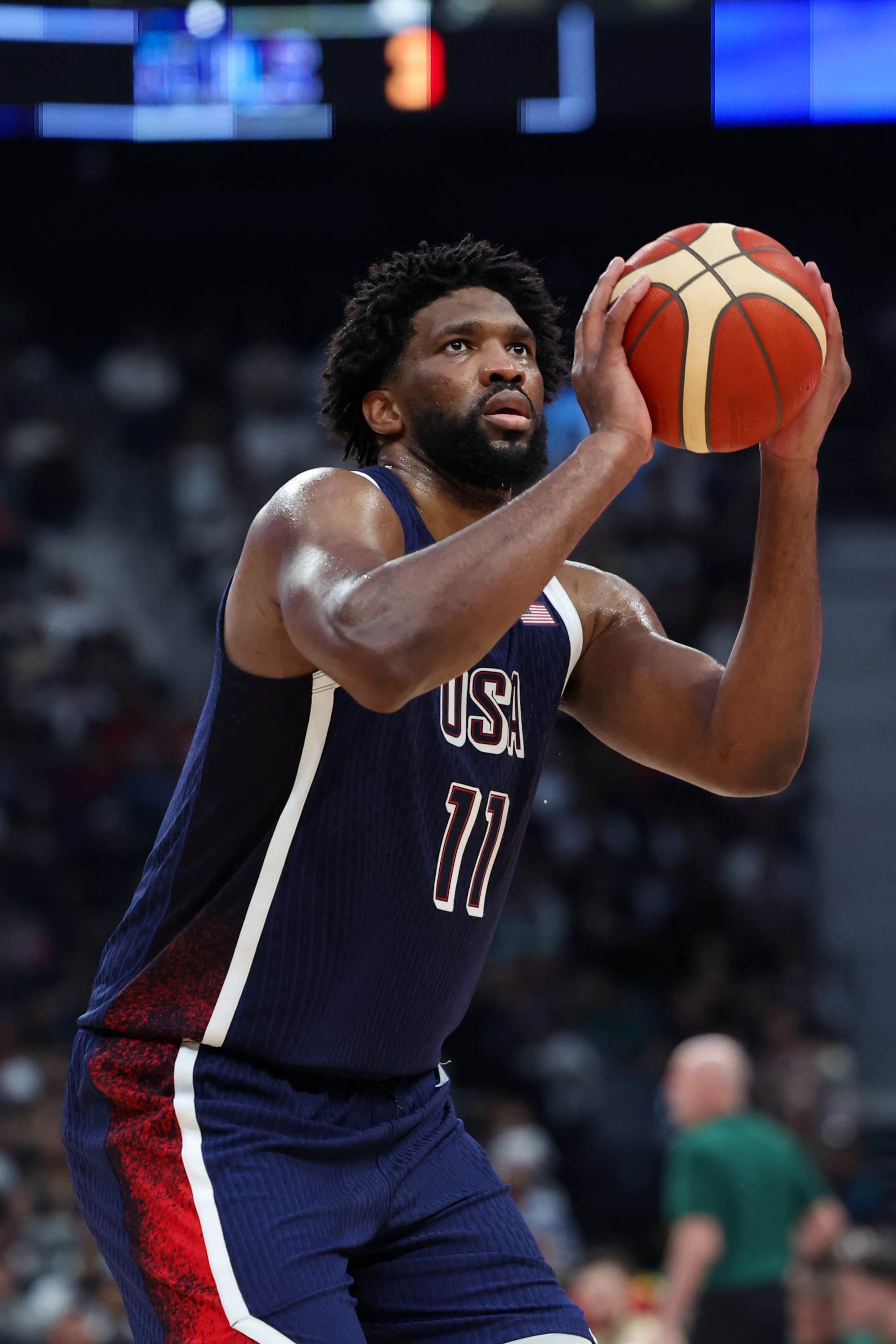 ABU DHABI, UAE - JULY 15: Joel Embiid #11 of Team USA shoots a free throw during the game against the Australian Basketball Men's Team during the 2024 USA Basketball Showcase on July 15, 2024 in Abu Dhabi, The United Arab Emirates at Etihad Arena. NOTE TO USER: User expressly acknowledges and agrees that, by downloading and/or using this Photograph, user is consenting to the terms and conditions of the Getty Images License Agreement. Mandatory Copyright Notice: Copyright 2024 NBAE (Photo by Joe Murphy/NBAE via Getty Images) ABU DHABI, UAE - JULY 15: Joel Embiid #11 of Team USA shoots a free throw during the game against the Australian Basketball Men's Team during the 2024 USA Basketball Showcase on July 15, 2024 in Abu Dhabi, The United Arab Emirates at Etihad Arena. NOTE TO USER: User expressly acknowledges and agrees that, by downloading and/or using this Photograph, user is consenting to the terms and conditions of the Getty Images License Agreement. Mandatory Copyright Notice: Copyright 2024 NBAE (Photo by Joe Murphy/NBAE via Getty Images)