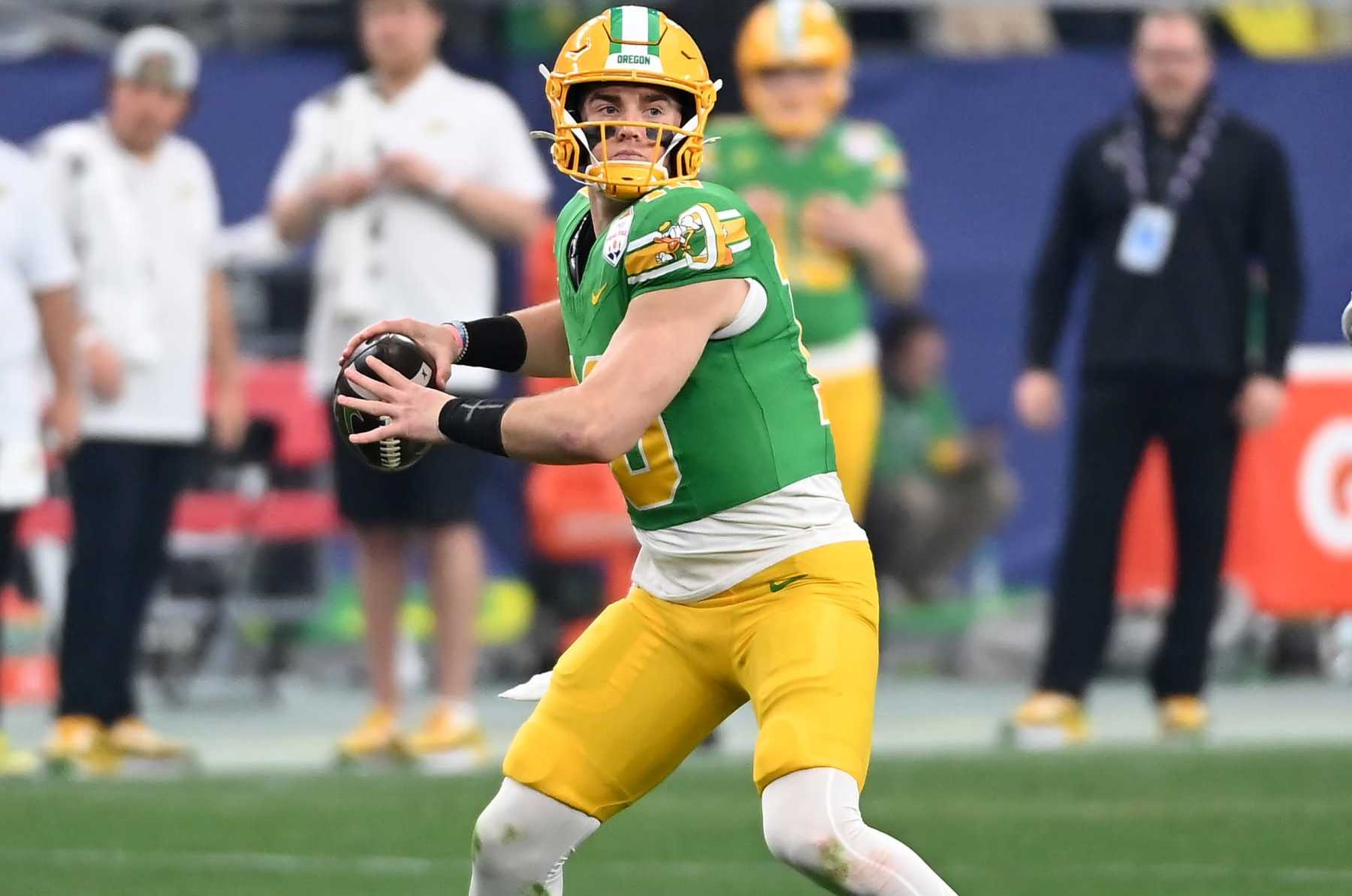 GLENDALE, ARIZONA - JANUARY 01: Bo Nix #10 of the Oregon Ducks throws the ball against the Liberty Flames during the 2023 Vrbo Fiesta Bowl game at State Farm Stadium on January 01, 2024 in Glendale, Arizona. (Photo by Norm Hall/Getty Images)