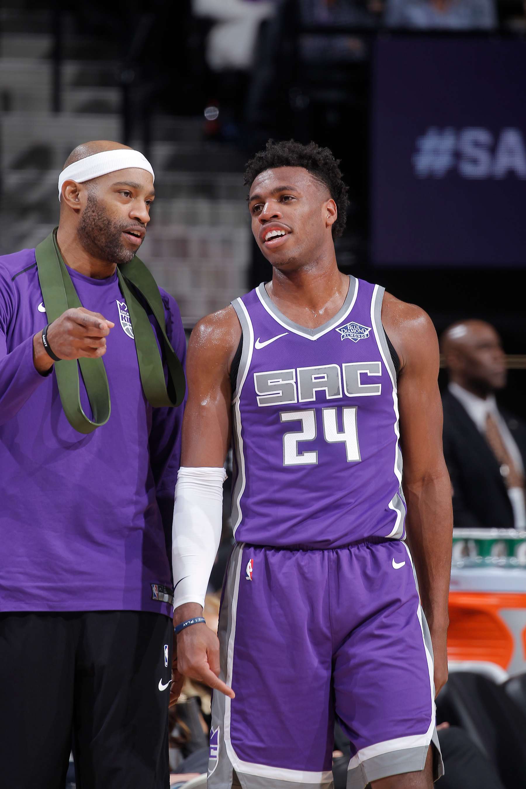SACRAMENTO, CA - DECEMBER 29: Vince Carter #15 and Buddy Hield #24 of the Sacramento Kings talk during the game against the Phoenix Suns on December 29, 2017 at Golden 1 Center in Sacramento, California. NOTE TO USER: User expressly acknowledges and agrees that, by downloading and or using this photograph, User is consenting to the terms and conditions of the Getty Images Agreement. Mandatory Copyright Notice: Copyright 2017 NBAE (Photo by Rocky Widner/NBAE via Getty Images)