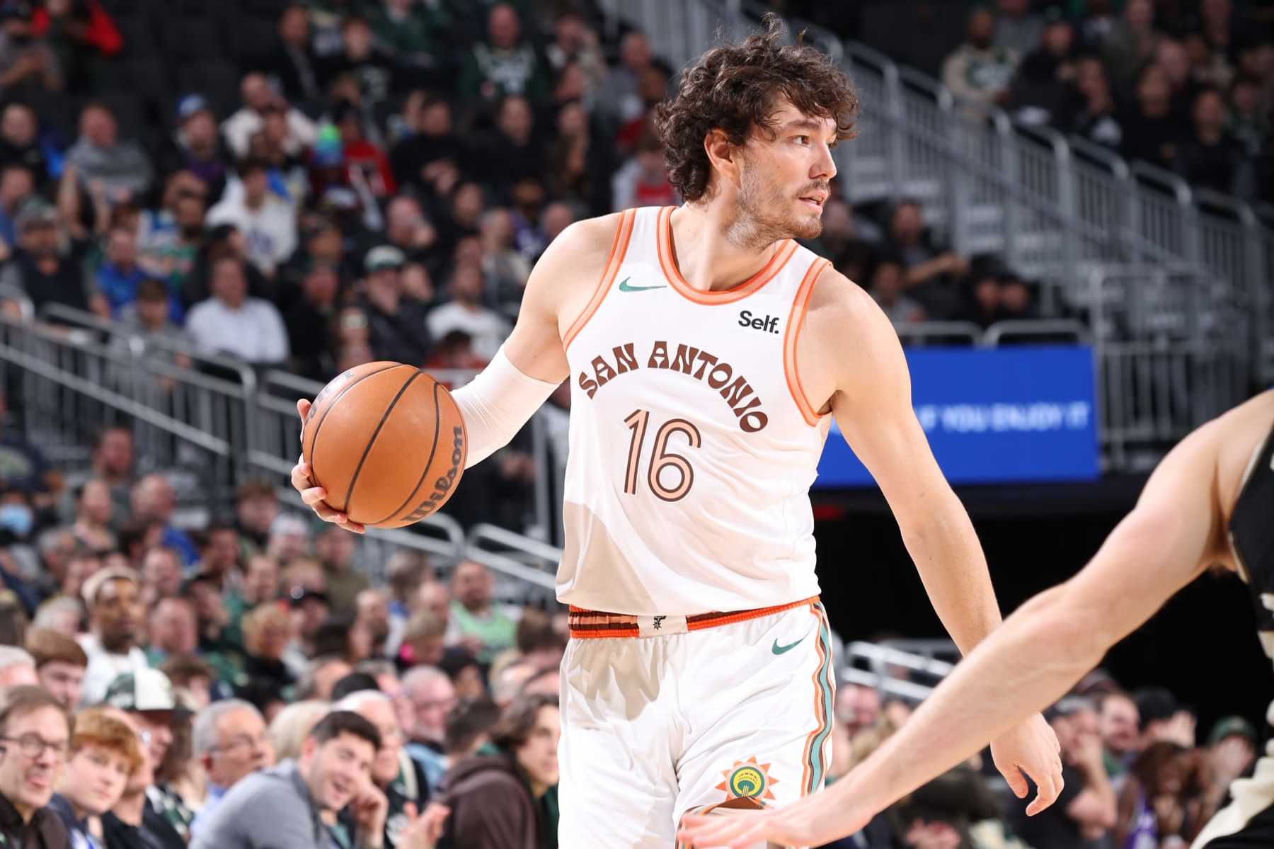 MILWAUKEE, WI - DECEMBER 19: Cedi Osman #16 of the San Antonio Spurs handles the ball during the game against the Milwaukee Bucks on December 19, 2023 at the Fiserv Forum Center in Milwaukee, Wisconsin. NOTE TO USER: User expressly acknowledges and agrees that, by downloading and or using this Photograph, user is consenting to the terms and conditions of the Getty Images License Agreement. Mandatory Copyright Notice: Copyright 2023 NBAE (Photo by Gary Dineen/NBAE via Getty Images).