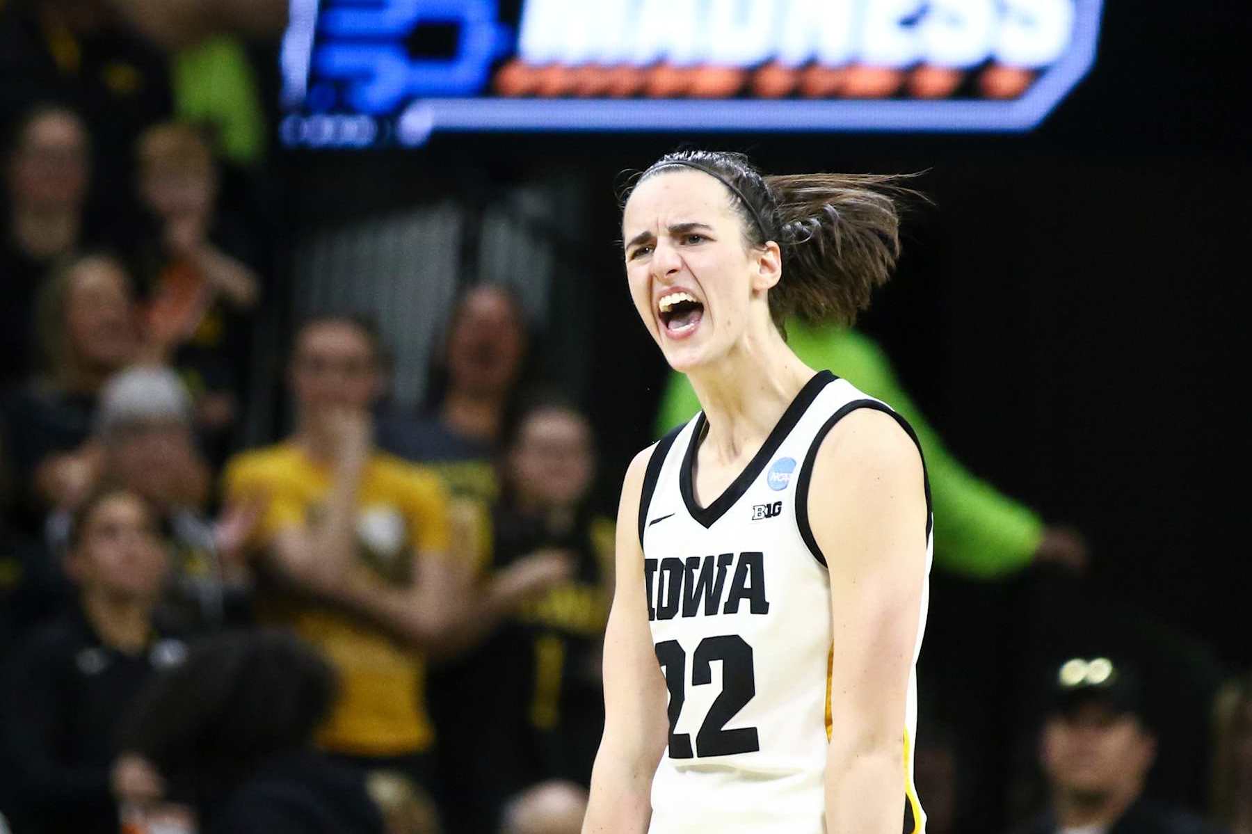 IOWA CITY, IOWA- MARCH 25: Guard Caitlin Clark #22 of the Iowa Hawkeyes celebrates after drawing a foul late in the second half against the West Virginia Mountaineers during their second round match-up in the 2024 NCAA Division 1 Womens Basketball Championship at Carver-Hawkeye Arena on March 25, 2024 in Iowa City, Iowa. (Photo by Matthew Holst/Getty Images)