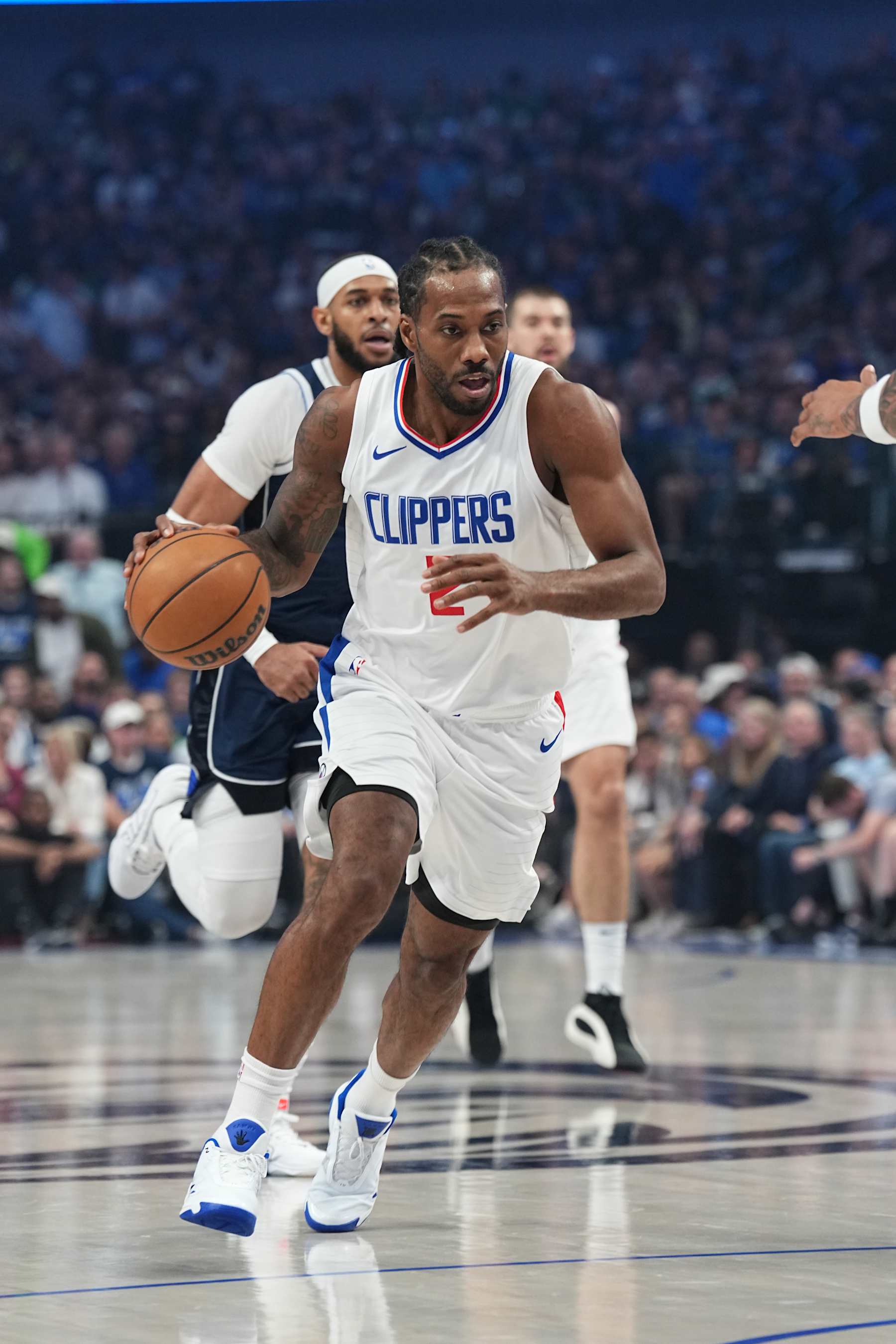 DALLAS, TX - APRIL 26: Kawhi Leonard #2 of the LA Clippers dribbles the ball during the game against the Dallas Mavericks during Round 1 Game 3 of the 2024 NBA Playoffs on April 26, 2024 at the American Airlines Center in Dallas, Texas. NOTE TO USER: User expressly acknowledges and agrees that, by downloading and or using this photograph, User is consenting to the terms and conditions of the Getty Images License Agreement. Mandatory Copyright Notice: Copyright 2023 NBAE (Photo by Glenn James/NBAE via Getty Images)
