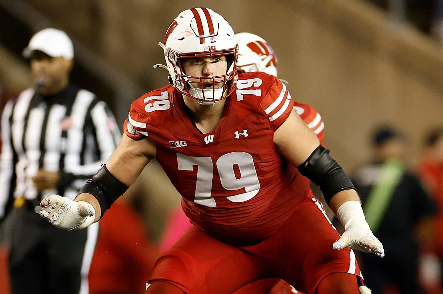 MADISON, WISCONSIN - OCTOBER 26: Jack Nelson #79 of the Wisconsin Badgers pass blocks during the game against the Penn State Nittany Lions at Camp Randall Stadium on October 26, 2024 in Madison, Wisconsin. (Photo by John Fisher/Getty Images)