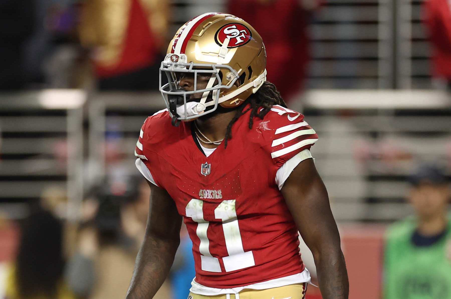 SANTA CLARA, CALIFORNIA - JANUARY 28: Brandon Aiyuk #11 of the San Francisco 49ers reacts after scoring a touchdown during the third quarter against the Detroit Lions in the NFC Championship Game at Levi's Stadium on January 28, 2024 in Santa Clara, California. (Photo by Ezra Shaw/Getty Images)