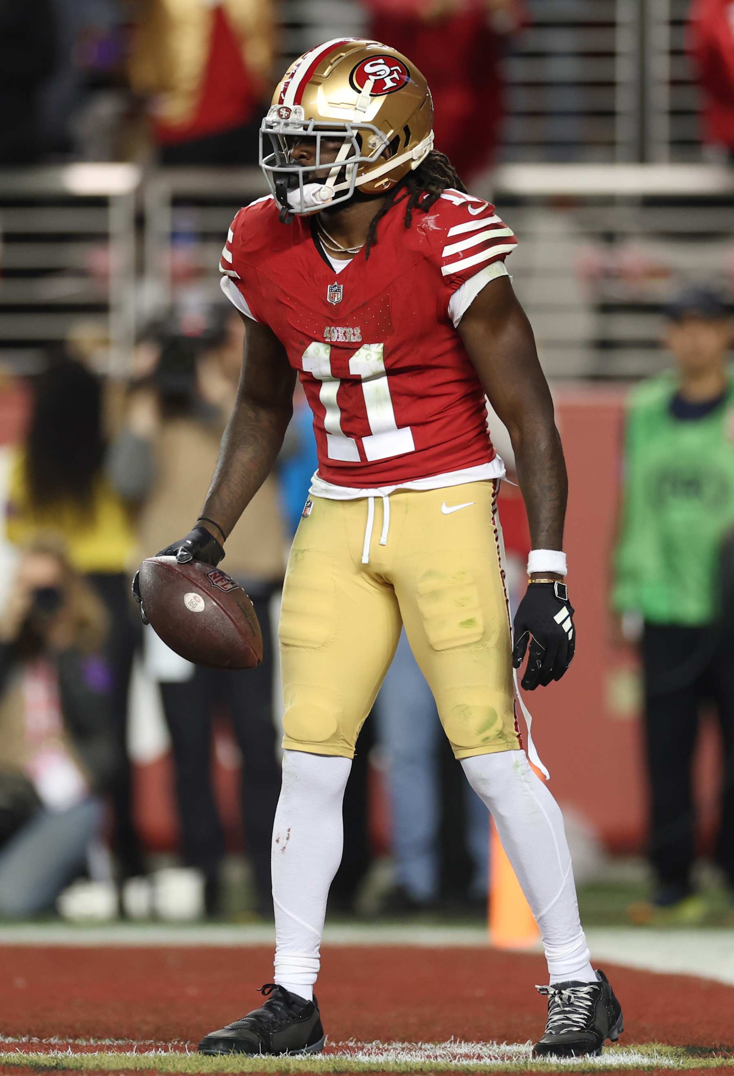 SANTA CLARA, CALIFORNIA - JANUARY 28: Brandon Aiyuk #11 of the San Francisco 49ers reacts after scoring a touchdown during the third quarter against the Detroit Lions in the NFC Championship Game at Levi's Stadium on January 28, 2024 in Santa Clara, California. (Photo by Ezra Shaw/Getty Images)