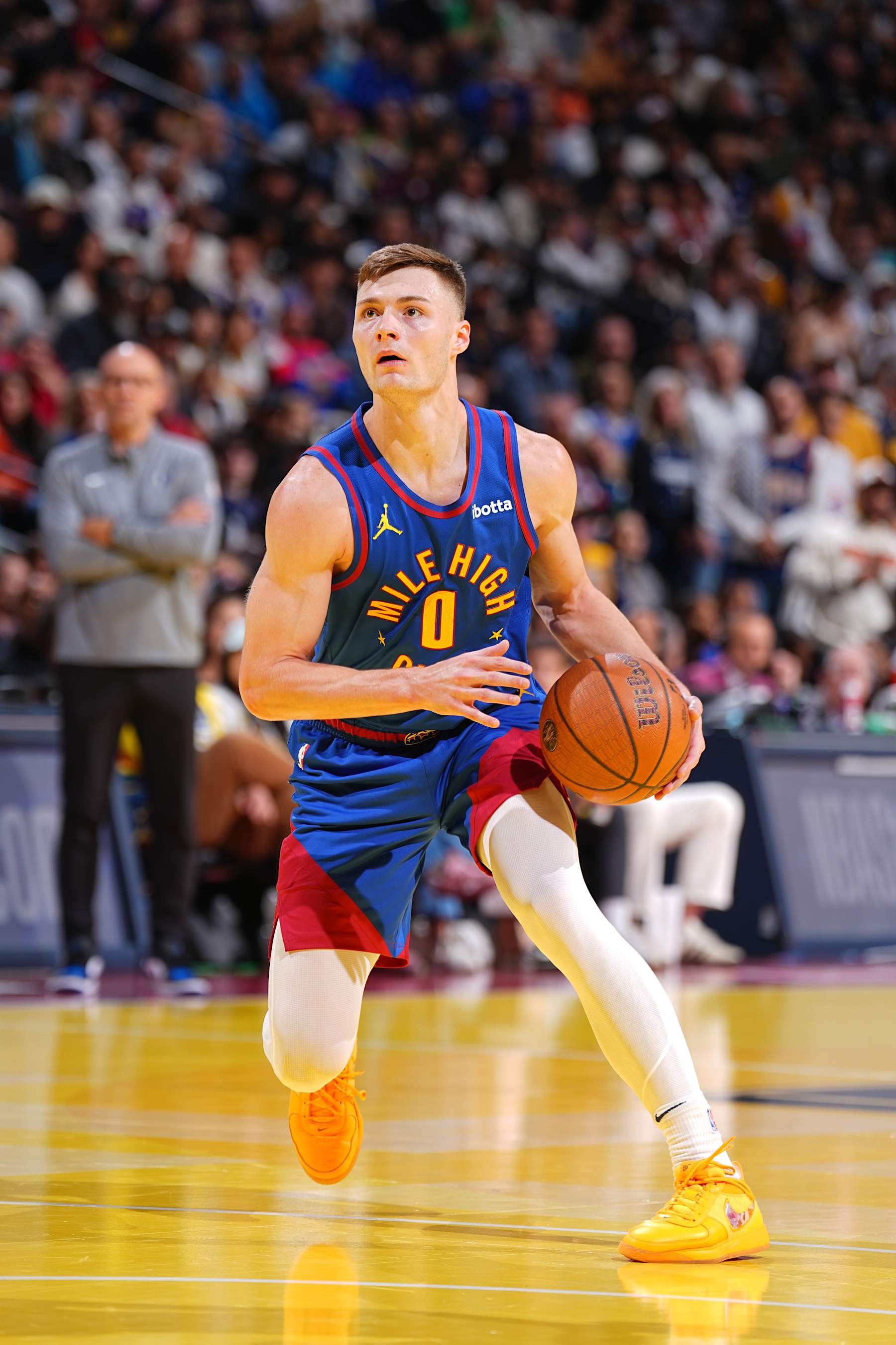 DENVER, CO - NOVEMBER 22: Christian Braun #0 of the Denver Nuggets drives to the basket during the game against the Dallas Mavericks during the Emirates NBA Cup game on November 22, 2024 at Ball Arena in Denver, Colorado. NOTE TO USER: User expressly acknowledges and agrees that, by downloading and/or using this Photograph, user is consenting to the terms and conditions of the Getty Images License Agreement. Mandatory Copyright Notice: Copyright 2024 NBAE (Photo by Garrett Ellwood/NBAE via Getty Images)