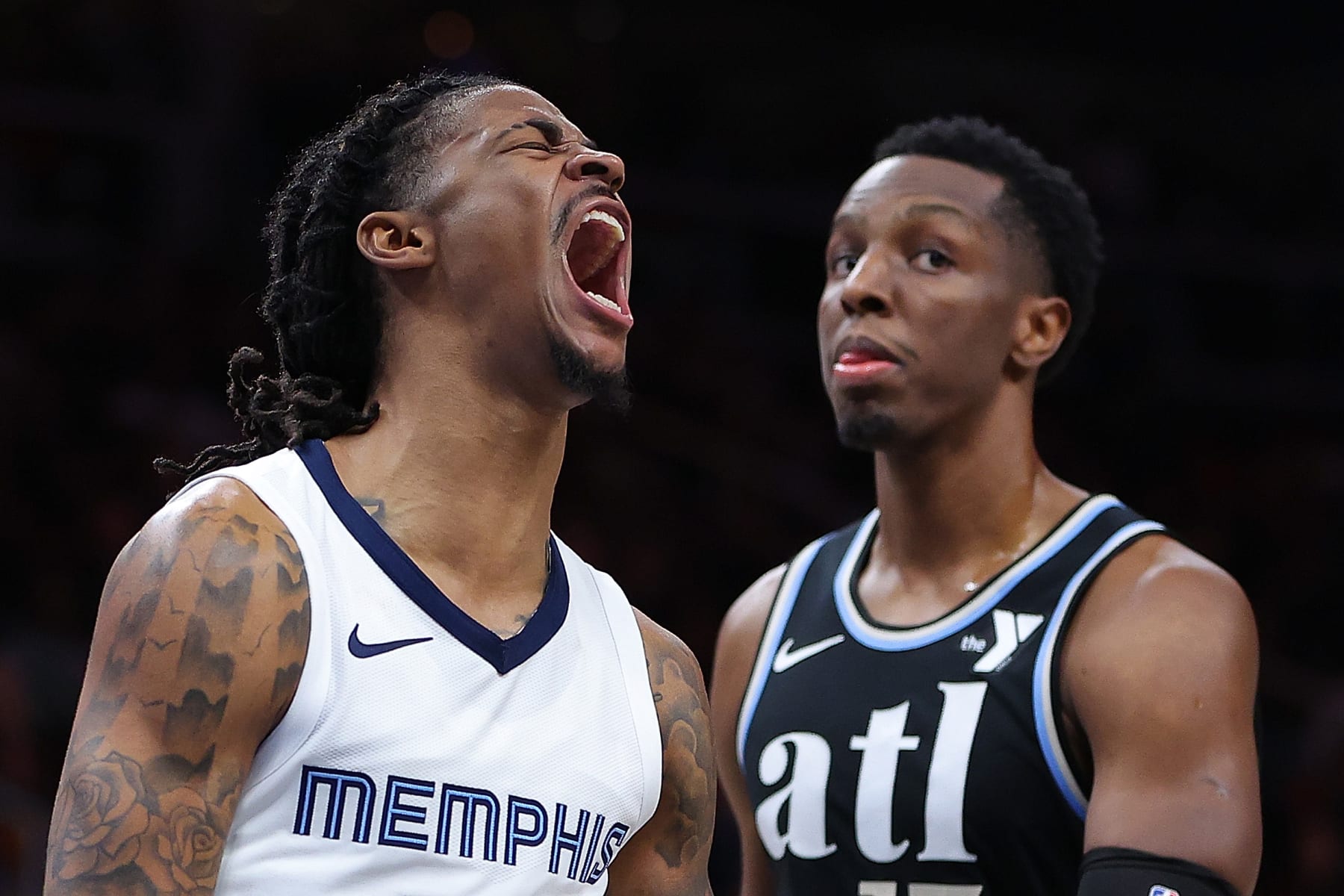 ATLANTA, GEORGIA - DECEMBER 23:  Ja Morant #12 of the Memphis Grizzlies reacts after dunking against the Atlanta Hawks during the third quarter at State Farm Arena on December 23, 2023 in Atlanta, Georgia.  NOTE TO USER: User expressly acknowledges and agrees that, by downloading and/or using this photograph, user is consenting to the terms and conditions of the Getty Images License Agreement. (Photo by Kevin C. Cox/Getty Images)