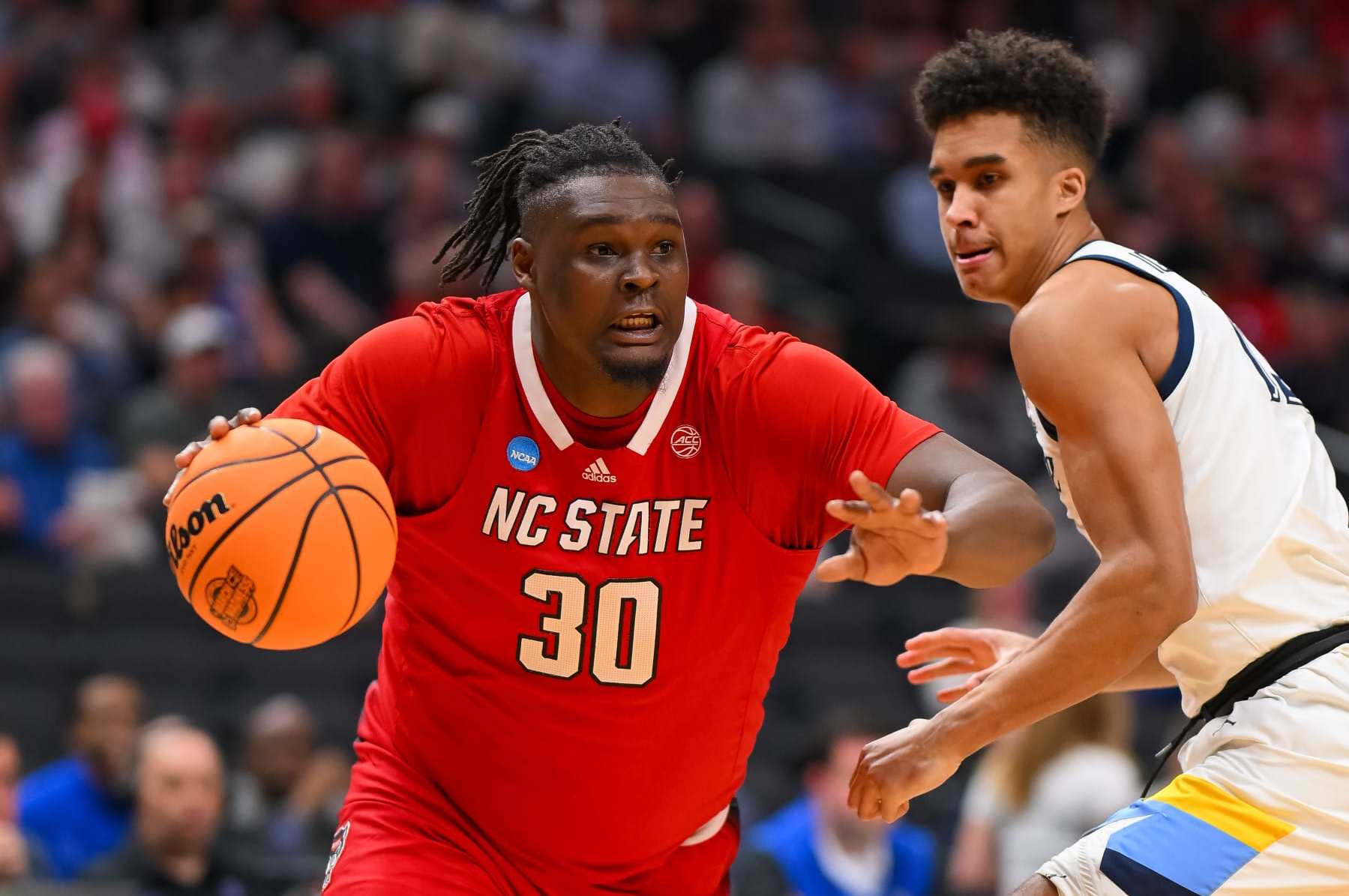 DALLAS, TEXAS - MARCH 29: DJ Burns Jr. #30 of the North Carolina State Wolfpack drives baseline during the Sweet Sixteen round of the 2024 NCAA Men's Basketball Tournament held at American Airlines Center on March 29, 2024 in Dallas, Texas. (Photo by Andy Hancock/NCAA Photos/NCAA Photos via Getty Images)