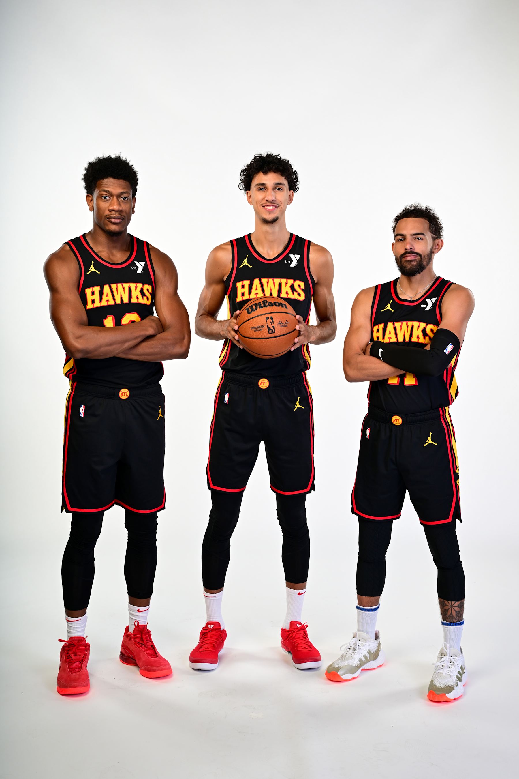 ATLANTA, GA - SEPTEMBER 30: De'Andre Hunter #12, Zaccharie Risacher #10 and Trae Young #11 of the Atlanta Hawks pose for a portrait during NBA Media Day on September 30, 2024 at PC&E Studios in Atlanta, Georgia. NOTE TO USER: User expressly acknowledges and agrees that, by downloading and or using this photograph, user is consenting to the terms and conditions of Getty Images License Agreement. Mandatory Copyright Notice: Copyright 2024 NBAE (Photo by Adam HagyNBAE via Getty Images)