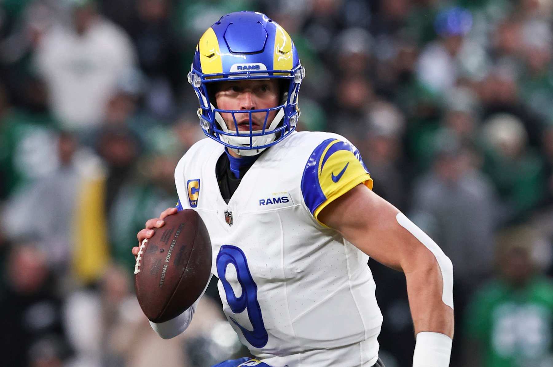 PHILADELPHIA, PENNSYLVANIA - JANUARY 19: Matthew Stafford #9 of the Los Angeles Rams scrambles during the NFC Divisional playoff game against the Philadelphia Eagles at Lincoln Financial Field on January 19, 2025 in Philadelphia, Pennsylvania. The Eagles defeated the Rams 28-22. (Kara Durrette/Getty Images)